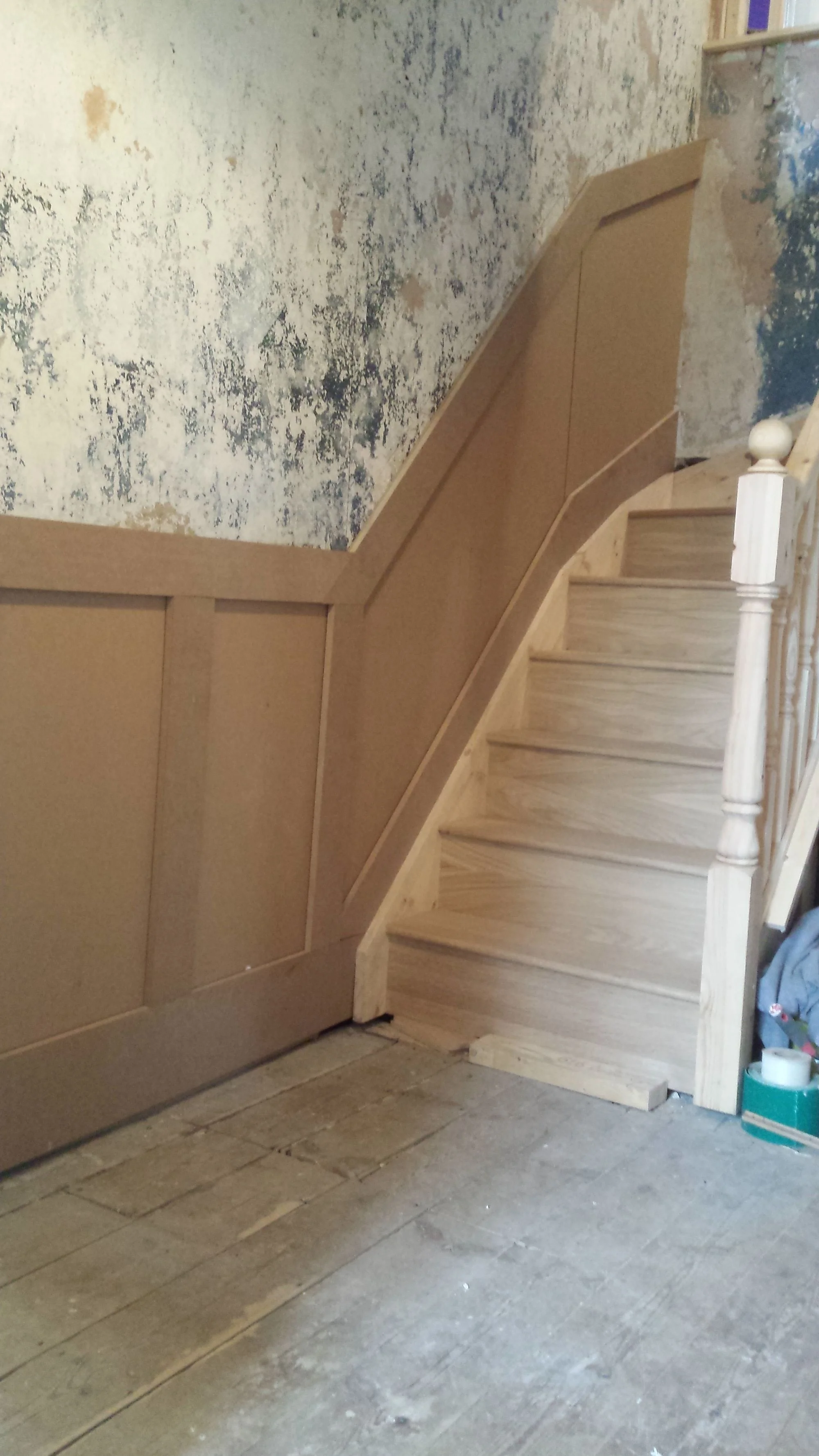 Bespoke timber staircase and wall panelling installation during a home renovation in Bridlington by Abbeydale Builders.