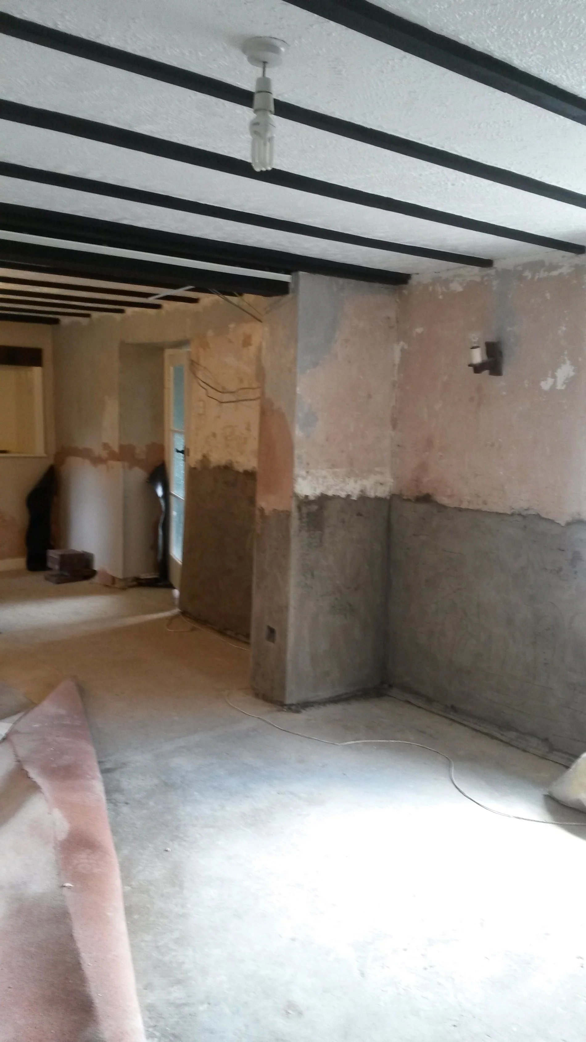 Full room renovation and damp proofing render application in Bridlington by Abbeydale Builders.