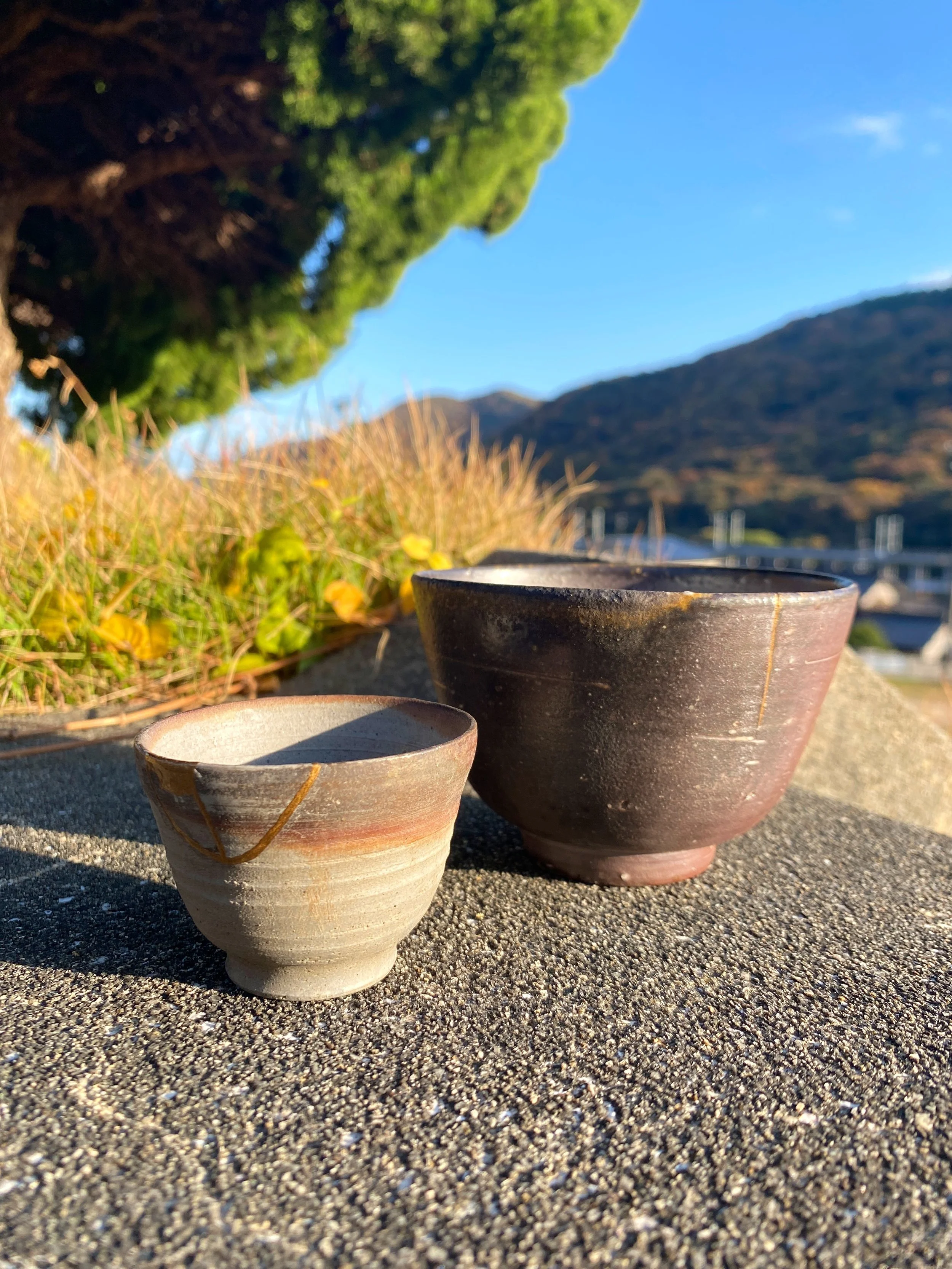 Two pieces repaired with kintsugi after a demonstration by our sensei at Bizen Pottery Center.