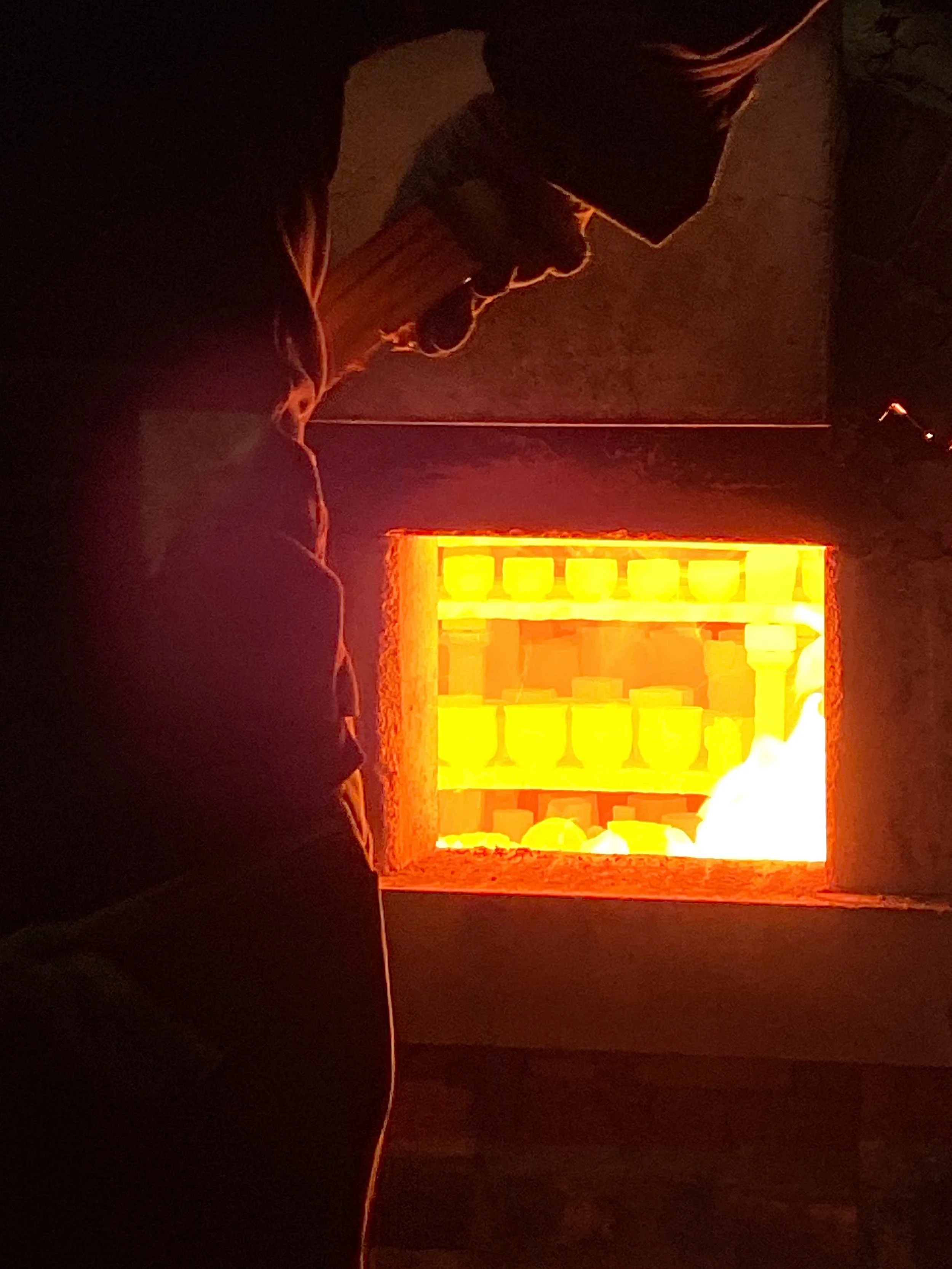 Detail of the first chamber window showing glowing pieces inside.