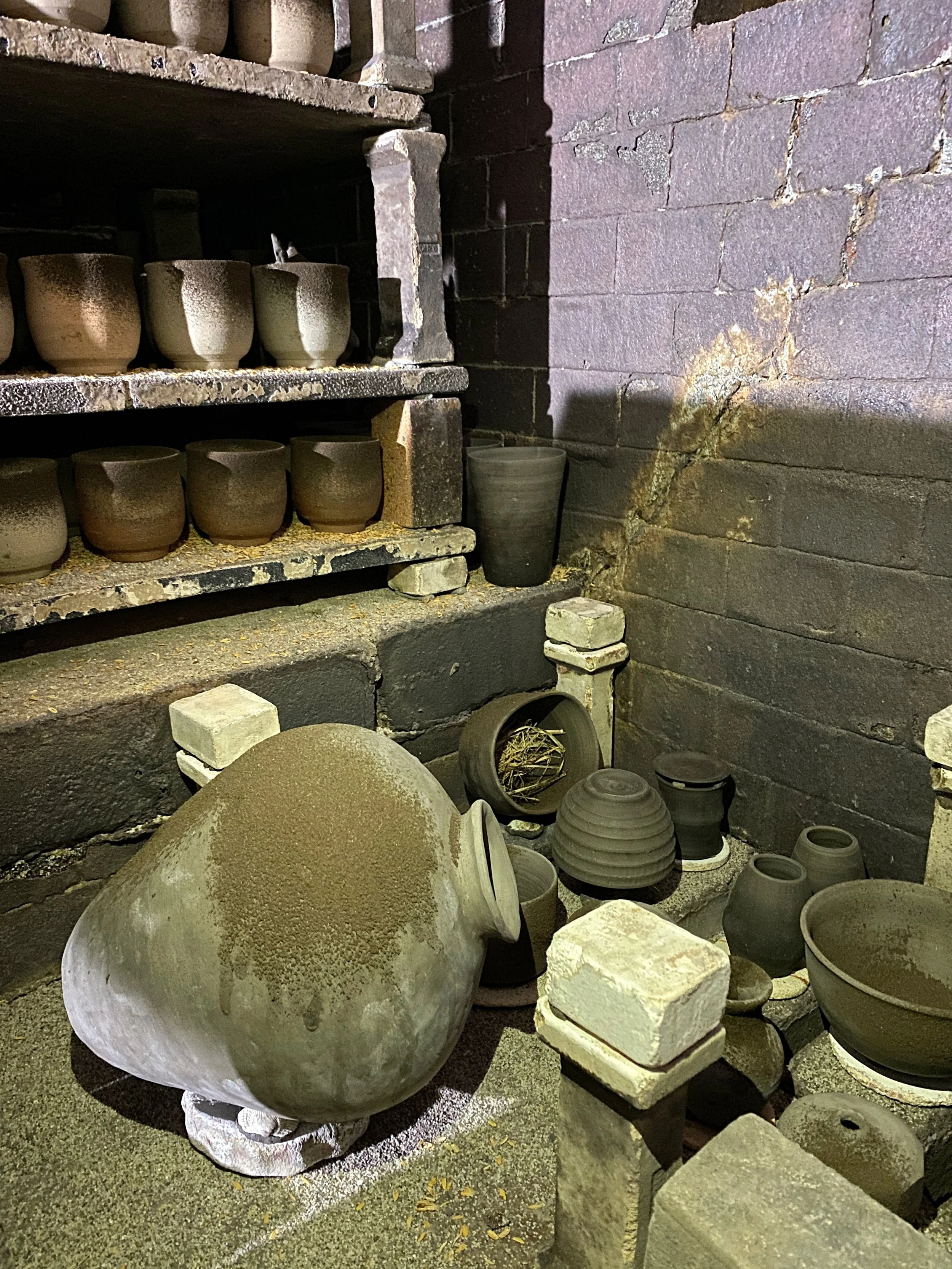 Inside the first chamber of the noborigama kiln, loaded with pieces for firing.