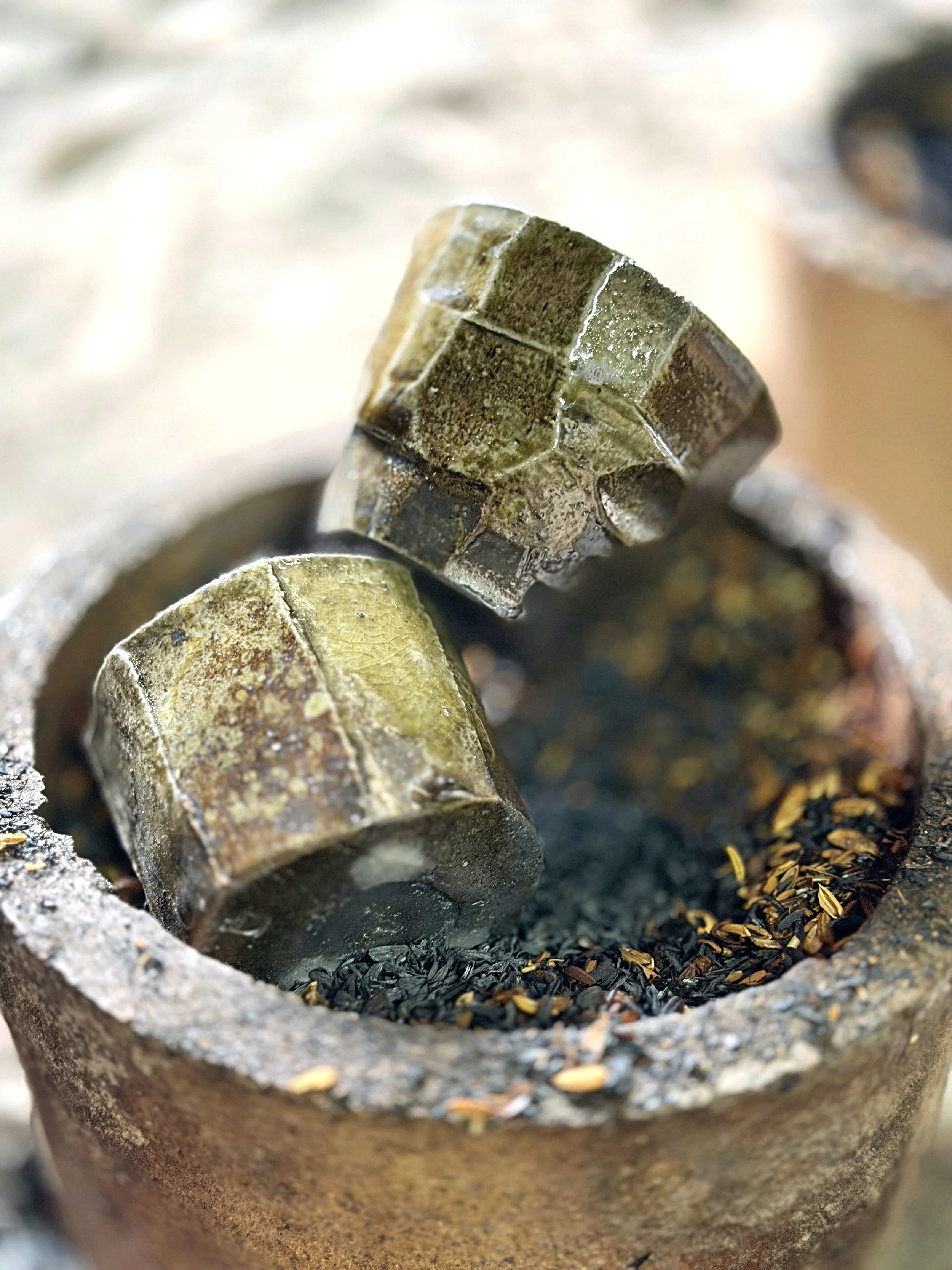 My two hikidashi pieces after being pulled from the kiln and placed in a sagar with rice husks, creating a strong reduction atmosphere and unique surface effects.