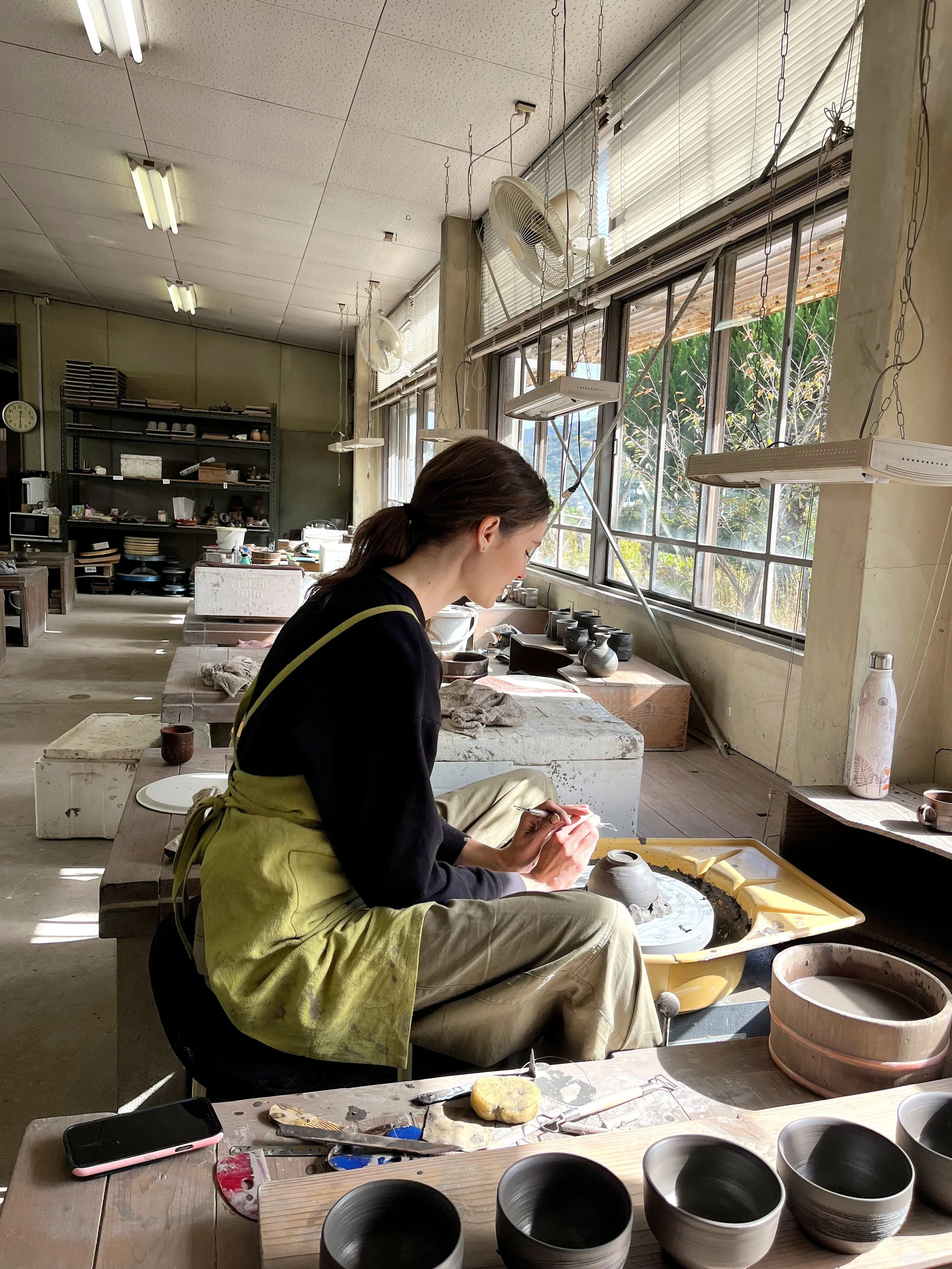 Working on the pottery wheel during my one-month course at Bizen Pottery Center.