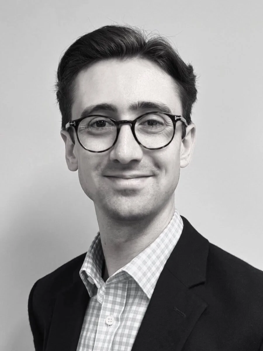 Black and white portrait of Alasdair Todd, Senior Account Director, Coulson Partners.
