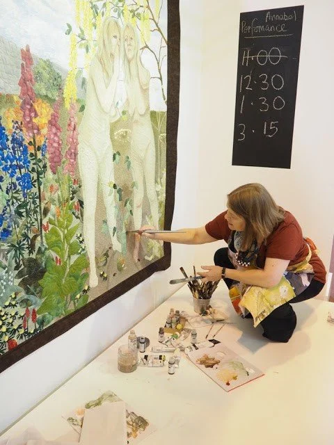 Annabel Rainbow painting live at the NEC on her quilt Poisonous Plant.