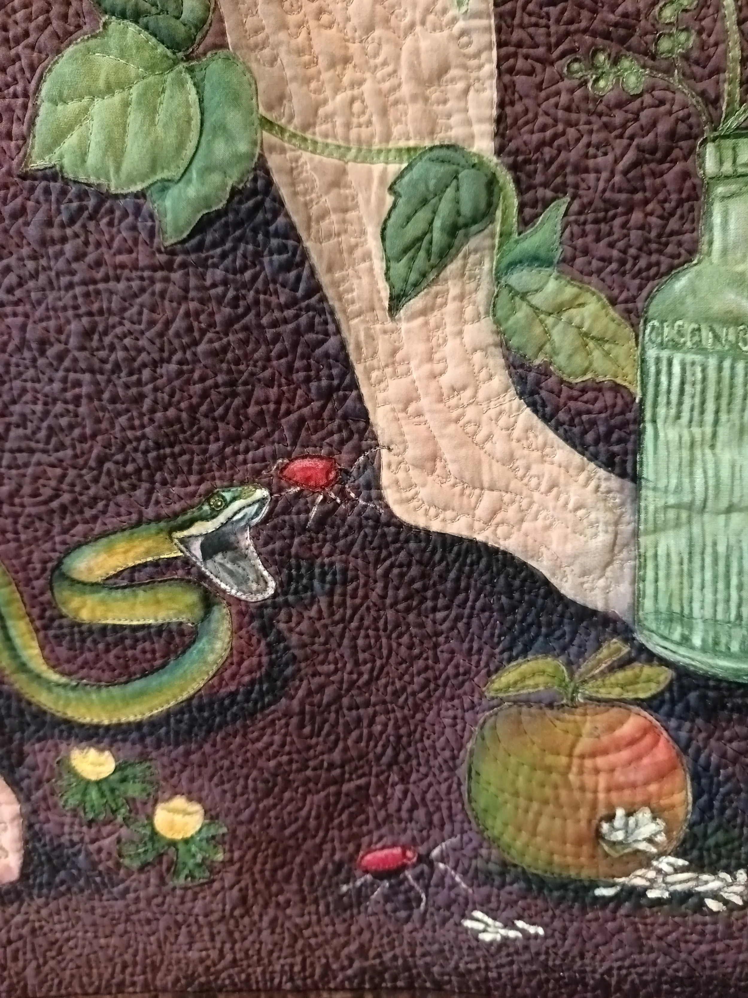 A detail from Poisonous Plant by Annabel Rainbow. Now in the collection of the Quilt Museum, York
