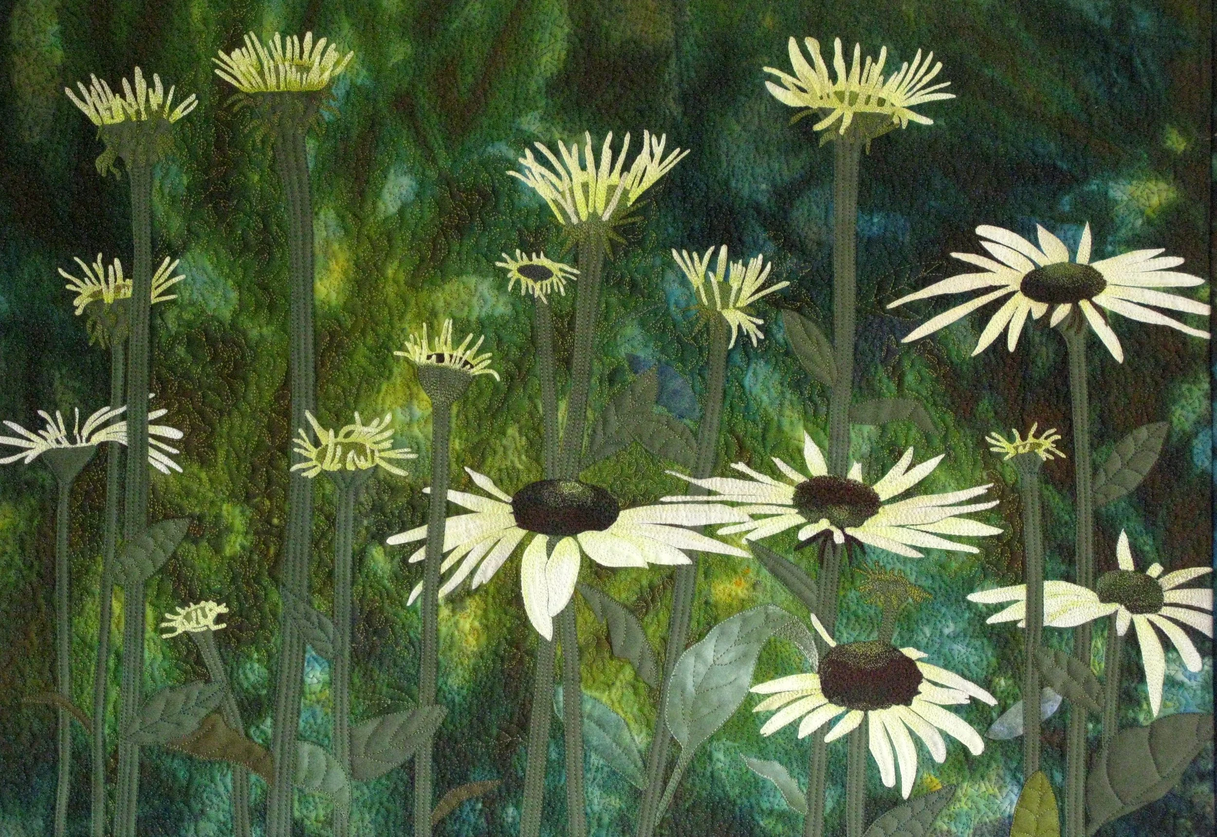 Fabric art depicting white daisies with yellow centers on a green textured background.