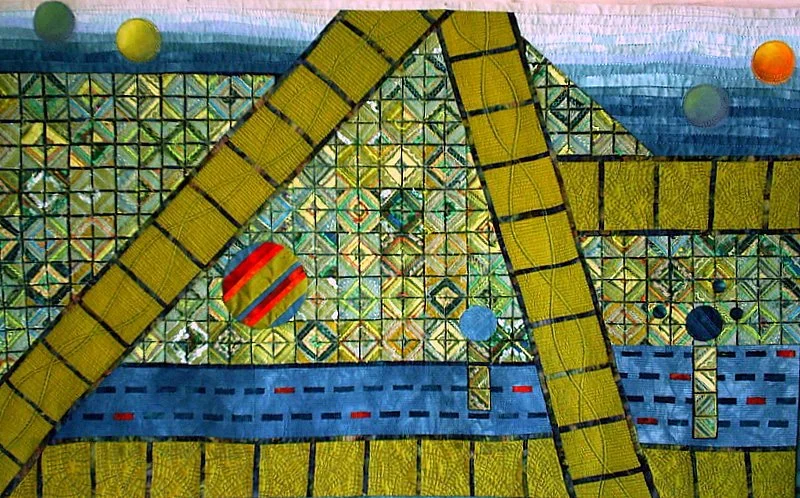 Abstract quilt design with geometric patterns and colorful circles