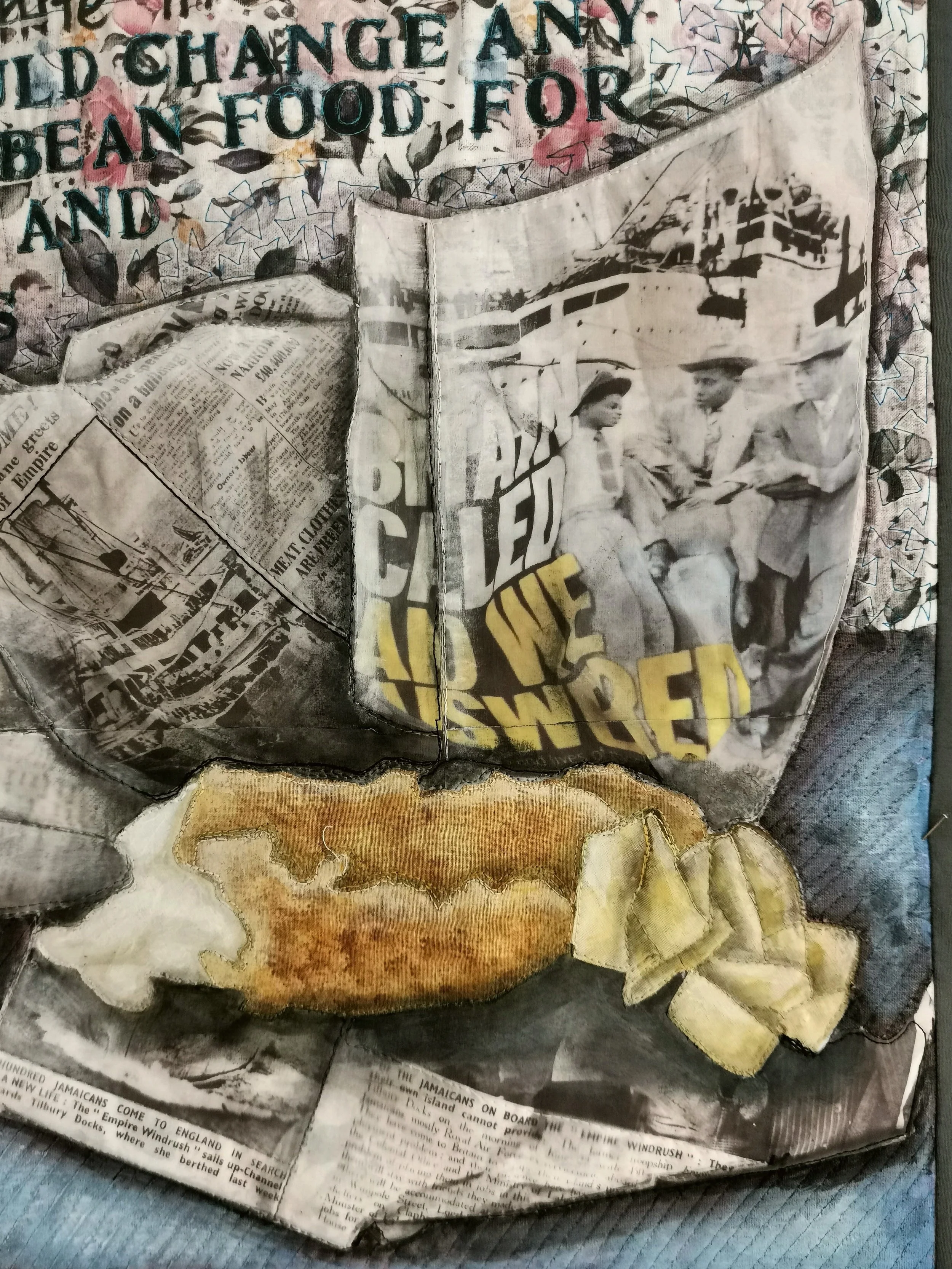 Collage artwork featuring newspaper clippings with text and images, overlaid with a textile piece resembling fish and chips.