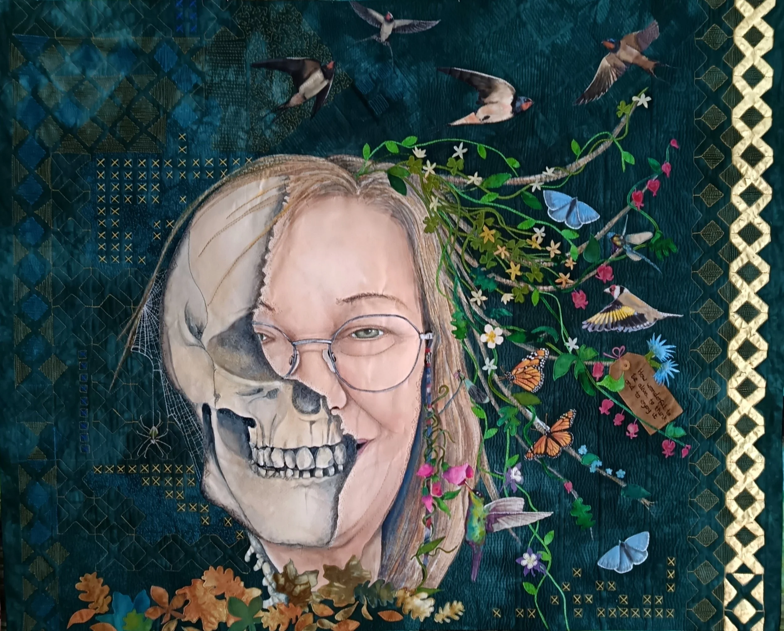 Mixed media artwork depicting a woman's face, half transformed into a skull, with glasses and blonde hair. Flowers, birds, and butterflies surround the face against a textured teal background with geometric patterns and gold accents.