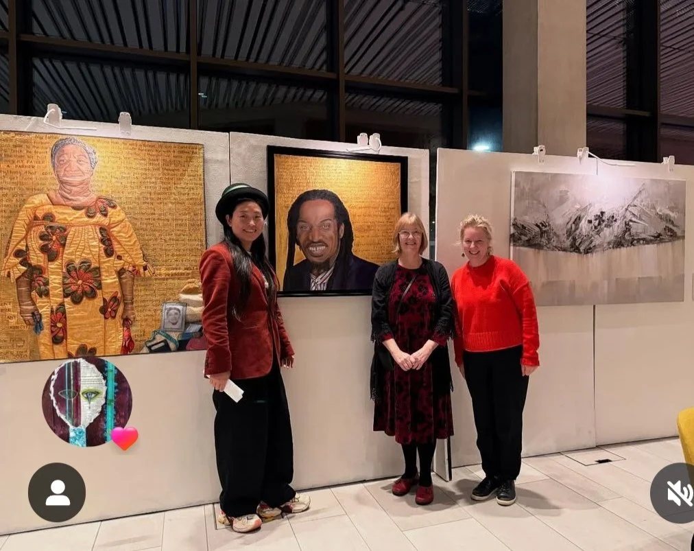 Benjamin Zephaniah Windrush portrait. Qian Zephaniah, Annabel Rainbow in front of his quilted portrait at Warwick Uni Oct 2025