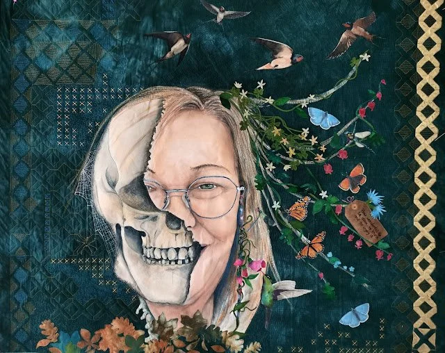 A woman with glasses smiling, with half of her face depicted as a skull, surrounded by flying birds, butterflies, flowers, and botanical elements against a textured dark background.