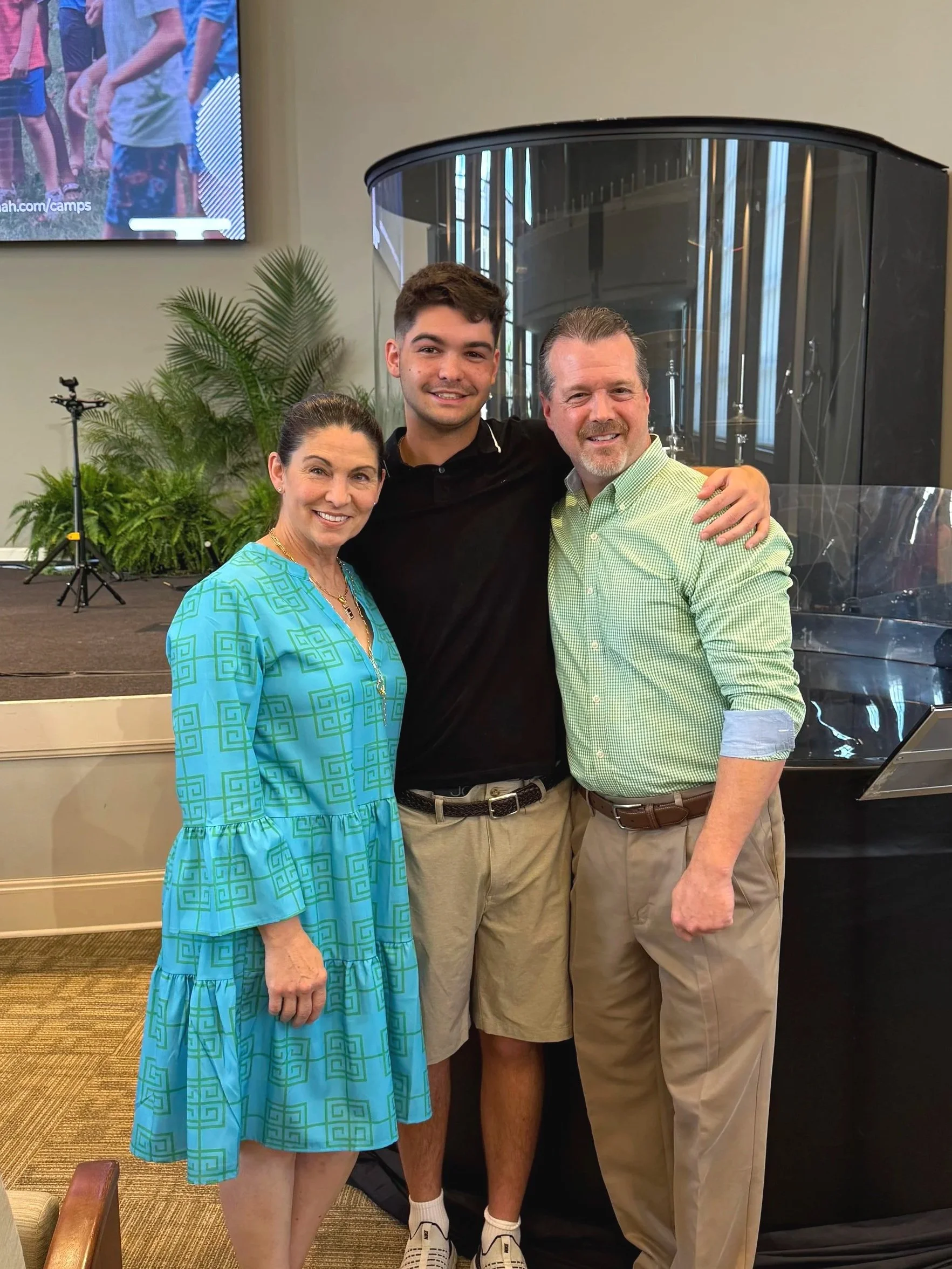 Three people, the owners of ERB Unlimited standing together.