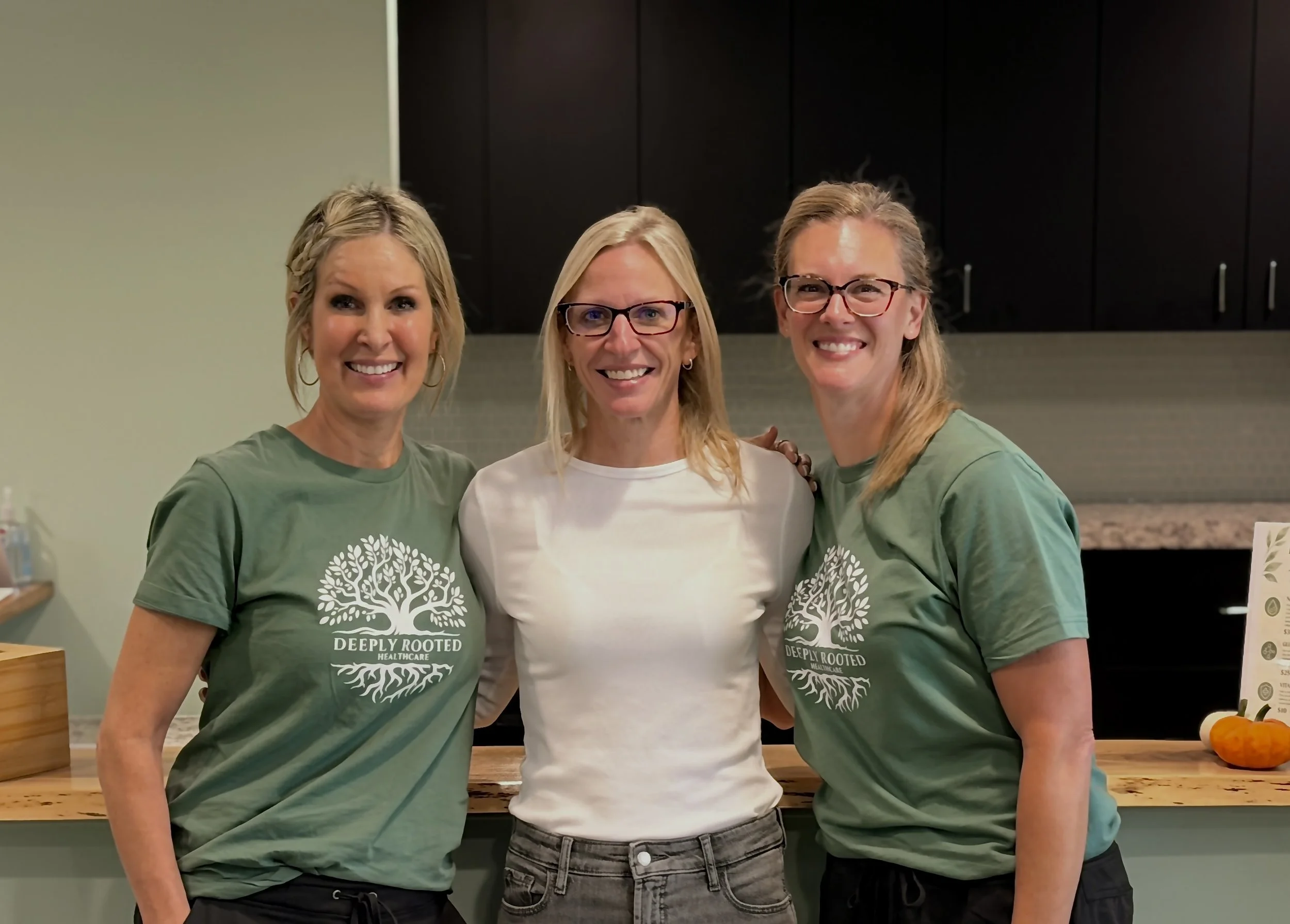 Employees at Deeply Rooted Healthcare for male and female hormones, peptides, and red light therapy