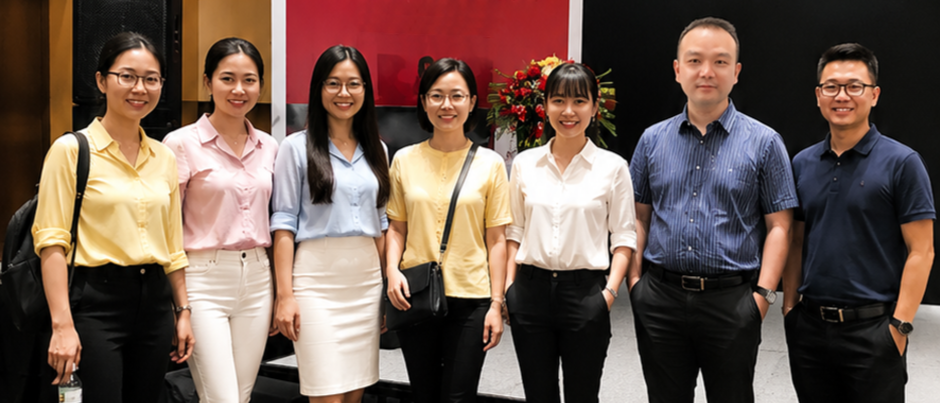 Group of seven Asian professionals, five women and two men, standing together indoors, smiling at the camera.
This is Dunlighten team, who makes importing from China as easy as local — but 30–70% cheaper.