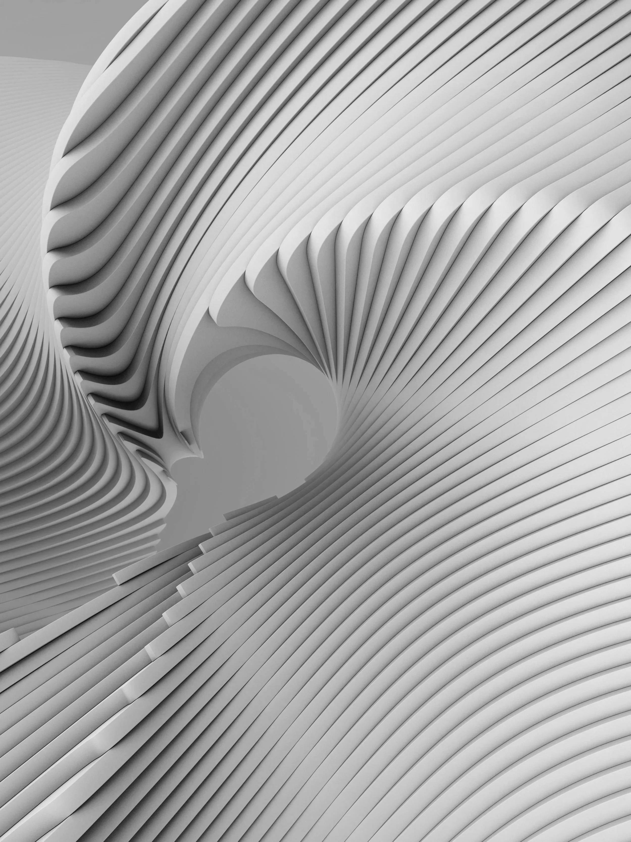 Close-up of a modern architectural structure with curved, layered white panels creating a flowing, abstract pattern.