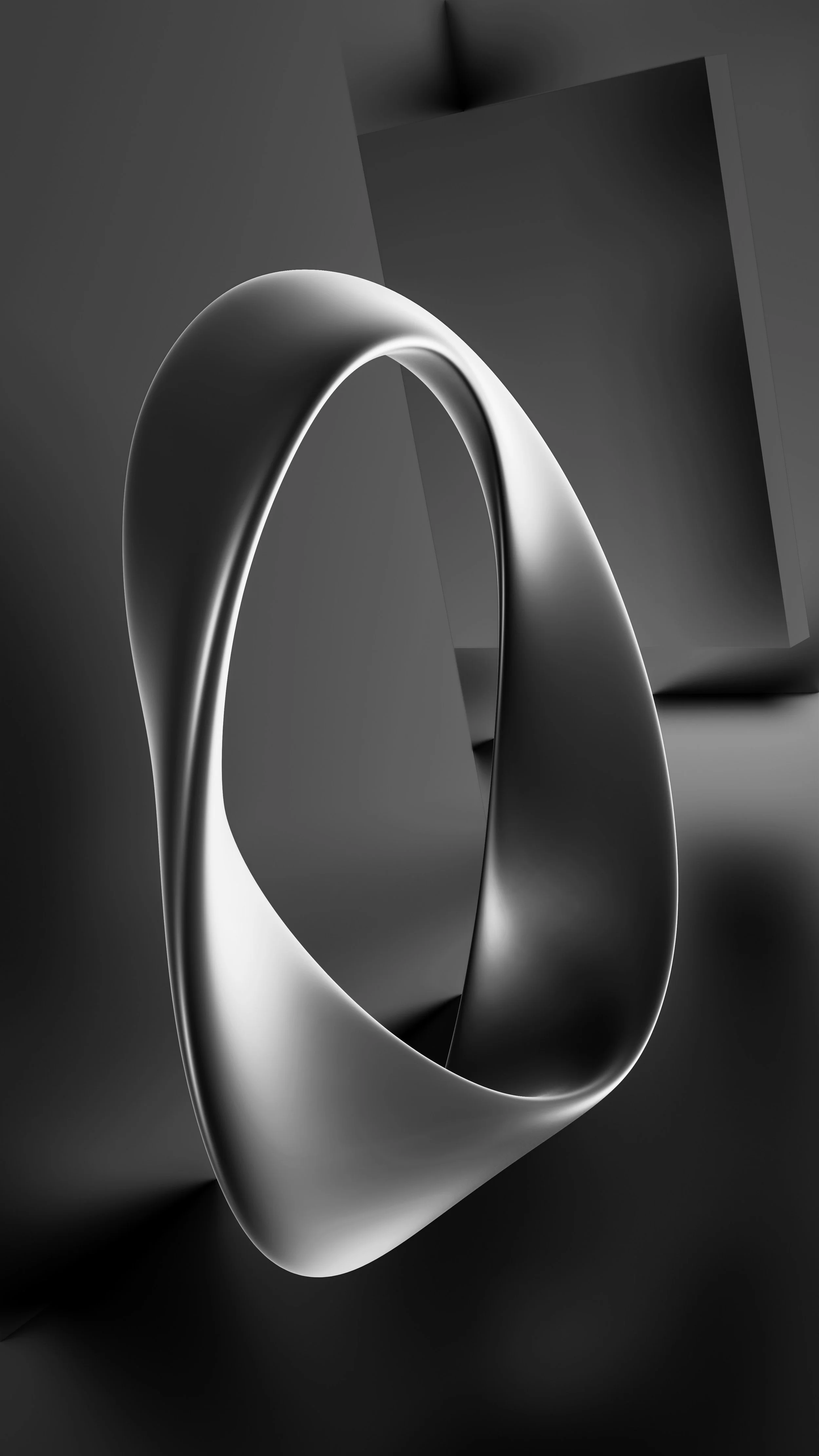 A close-up of a smooth, metallic ring with a reflective surface, set against a dark background with abstract geometric shapes.