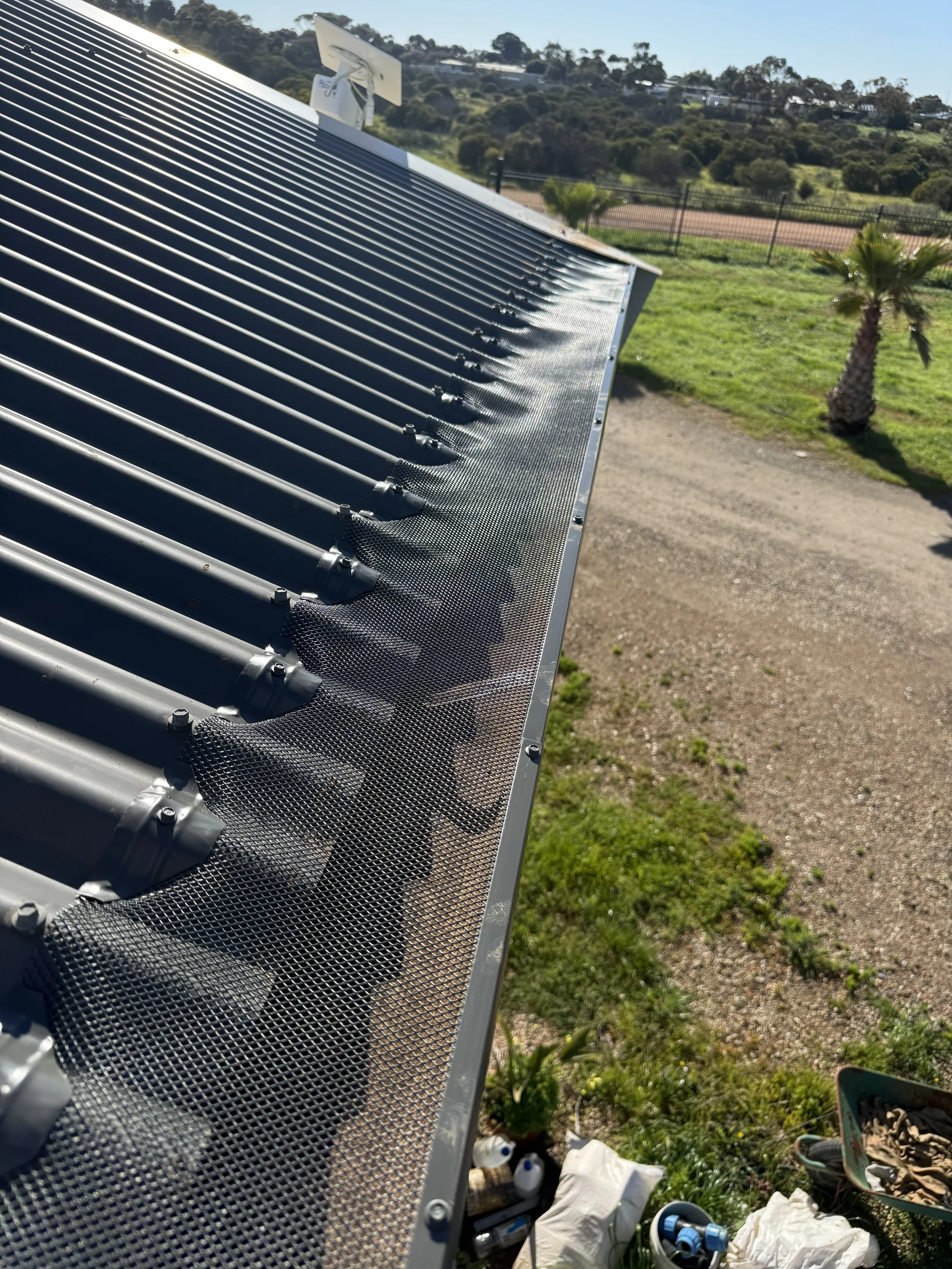 Gutter guard mesh installed on a Colorbond roof