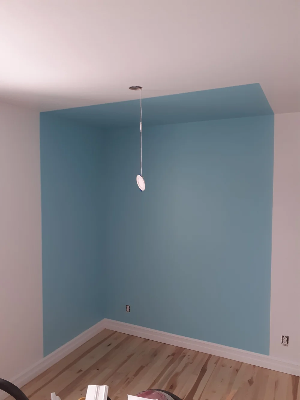 Blue accent colour extending from wall onto ceiling