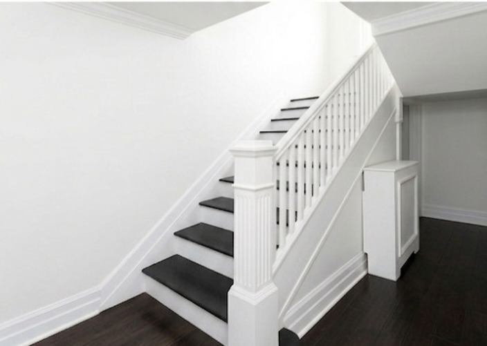 Painting wood trim, wood risers and wood treads for a home in Beaconsfield.