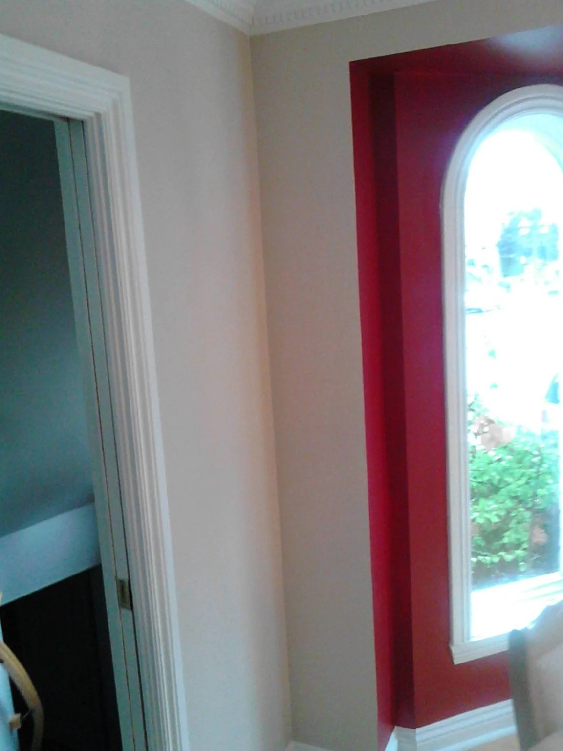 Red accent wall around a bay window