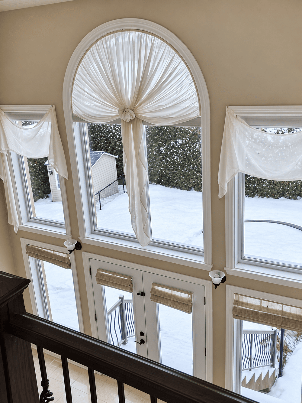 Tall arched window and painted architectural trim