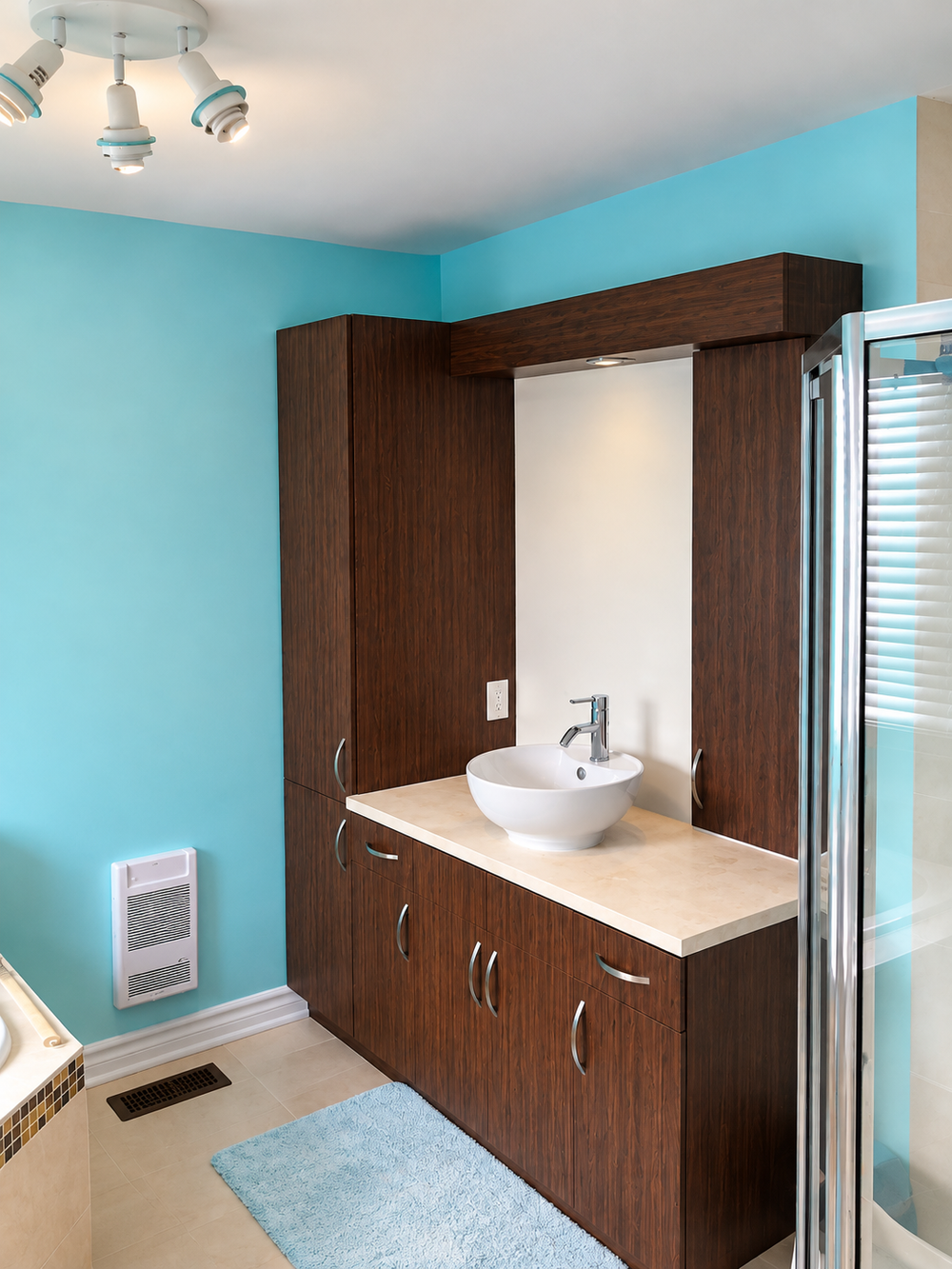 Turquoise bathroom with wood vanity
