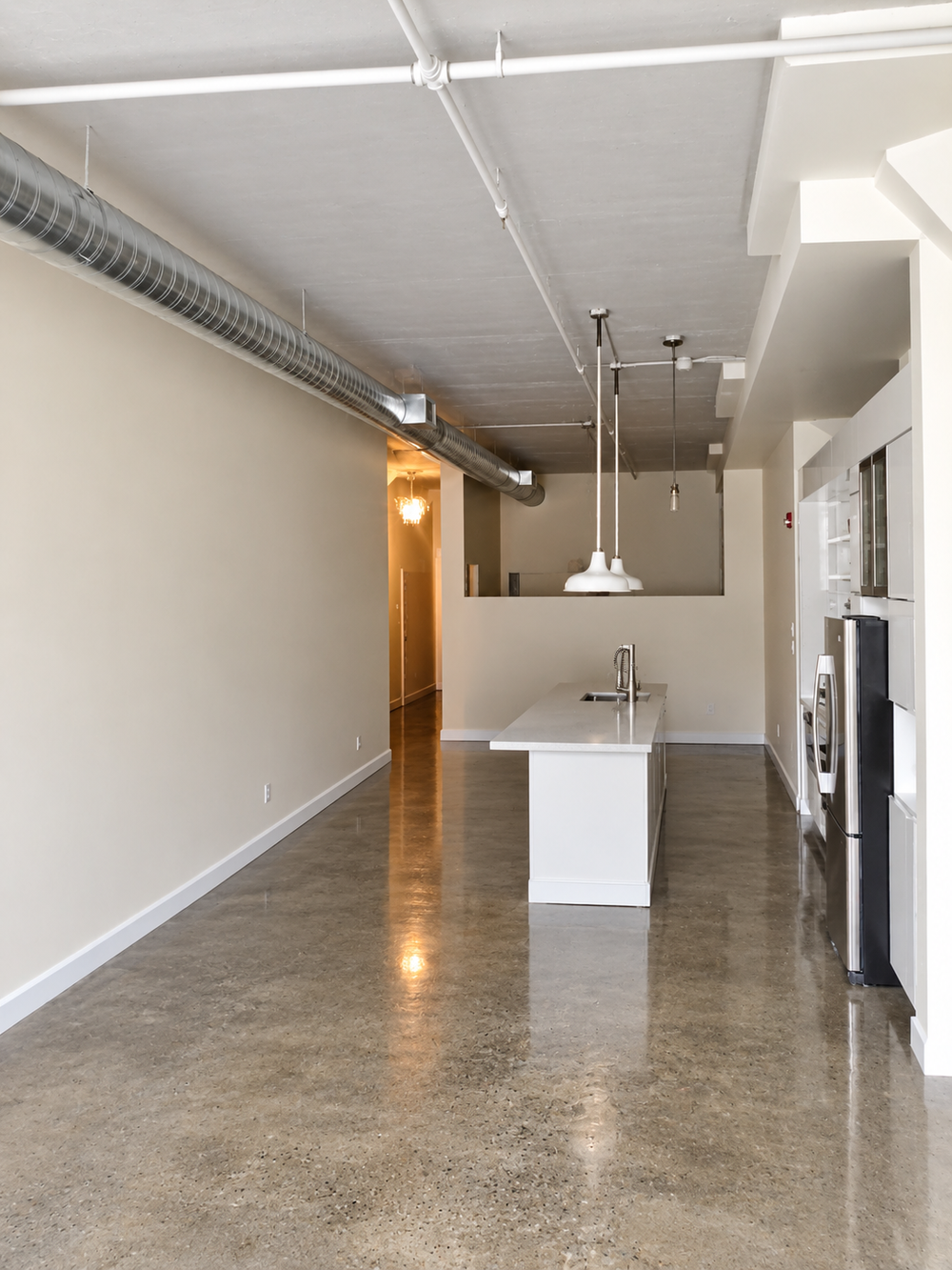 Open concept condo interior with painted walls