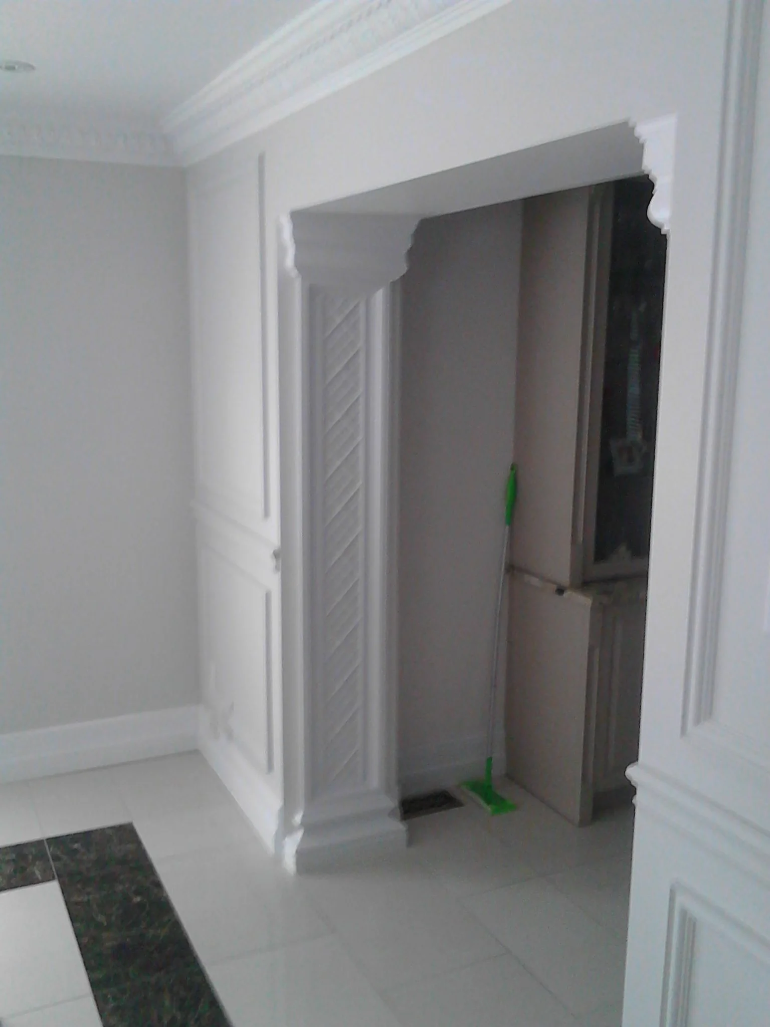 Interior arched doorway with decorative column details