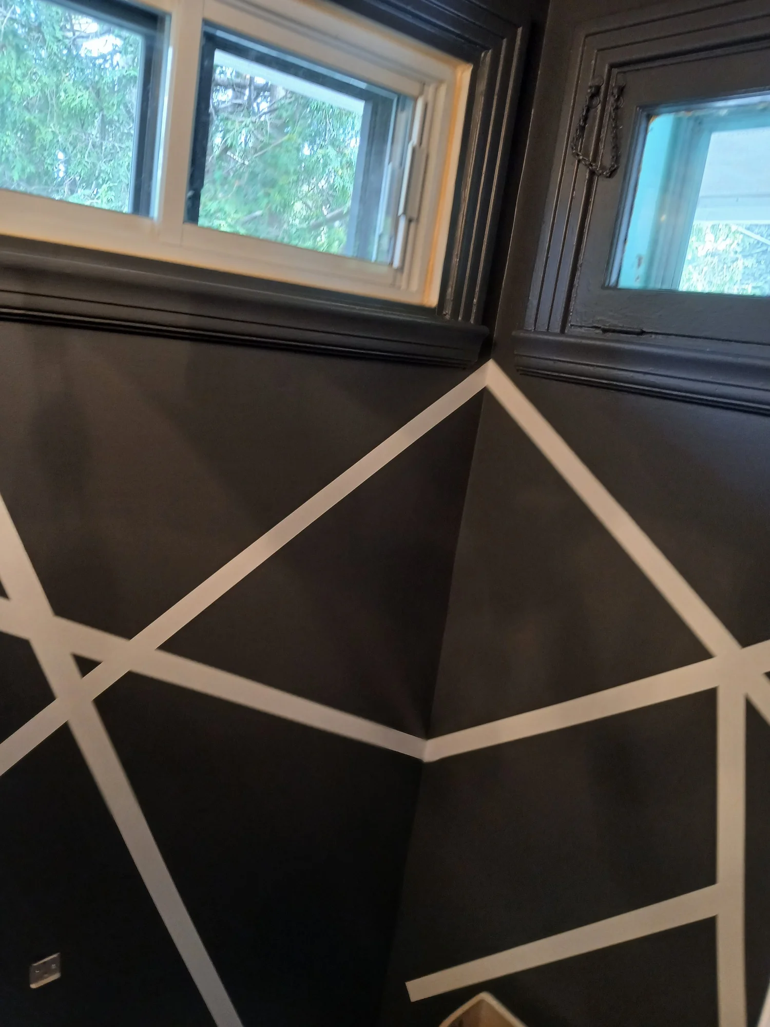 Another view of the geometric wall design in a bathroom