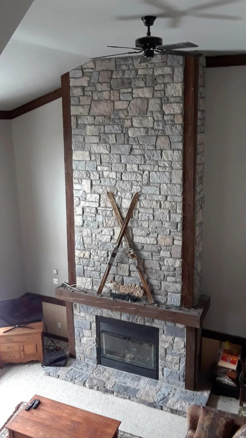 Vaulted room with stone fireplace