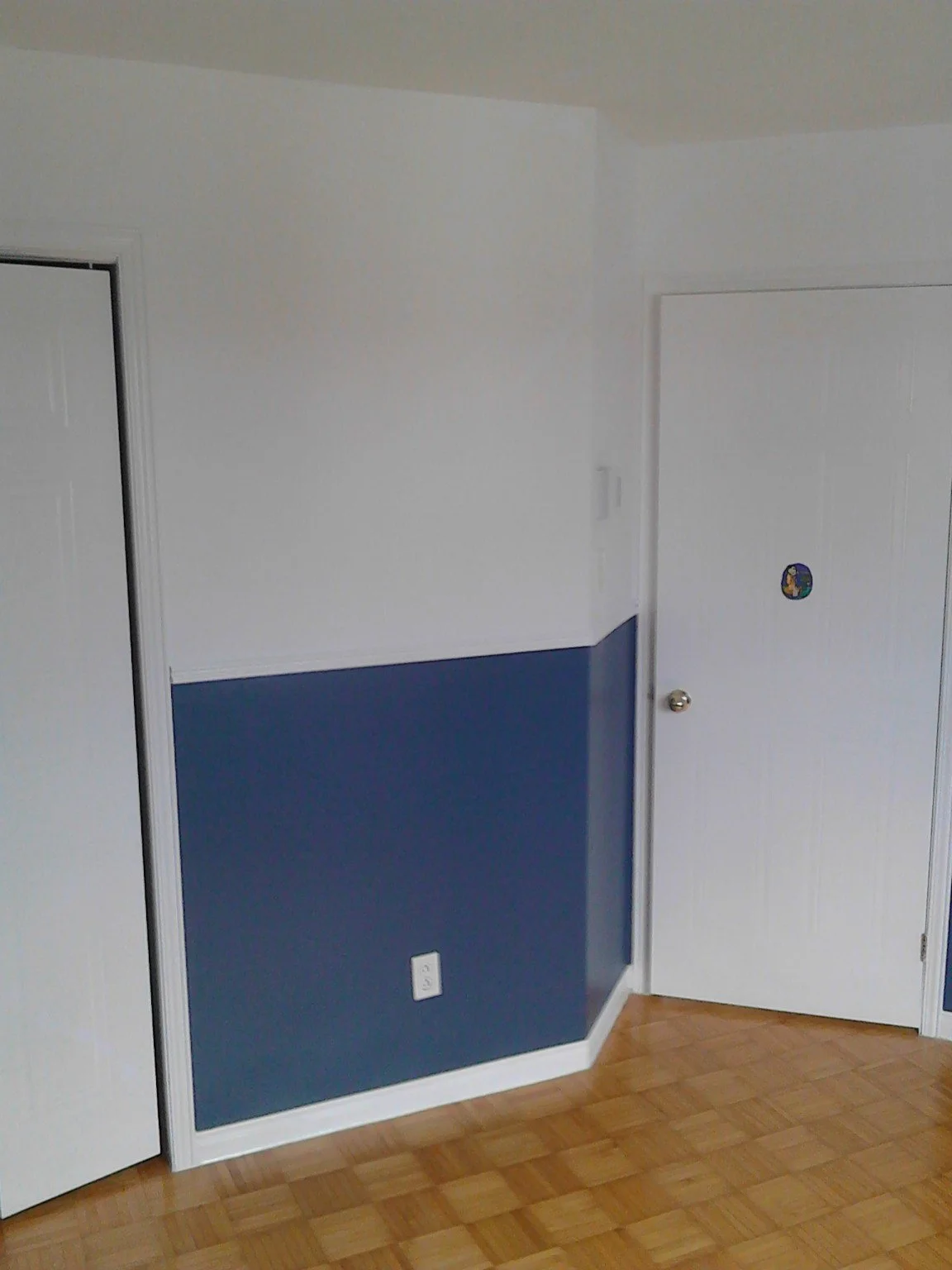 Beaconsfield interior with blue and white walls divided by a chair rail