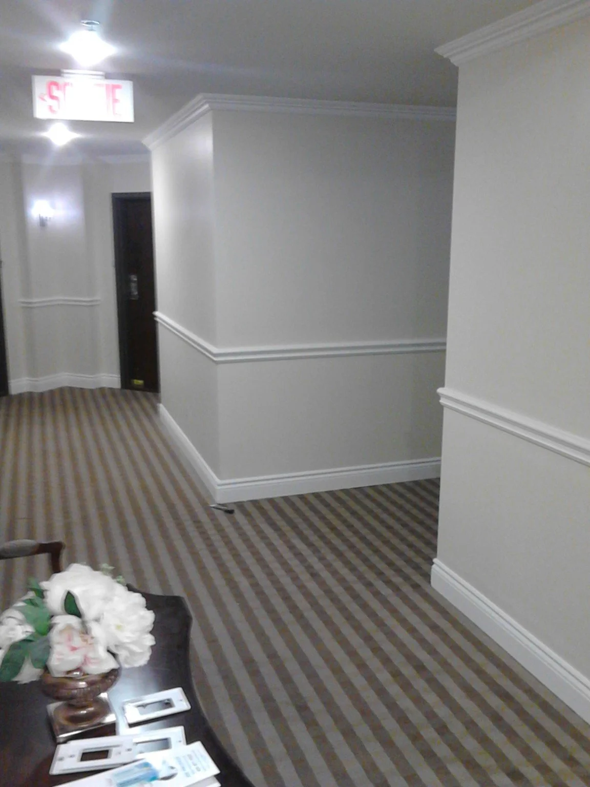 Dollard-des-Ormeaux condo common hallway with painted walls and white trim