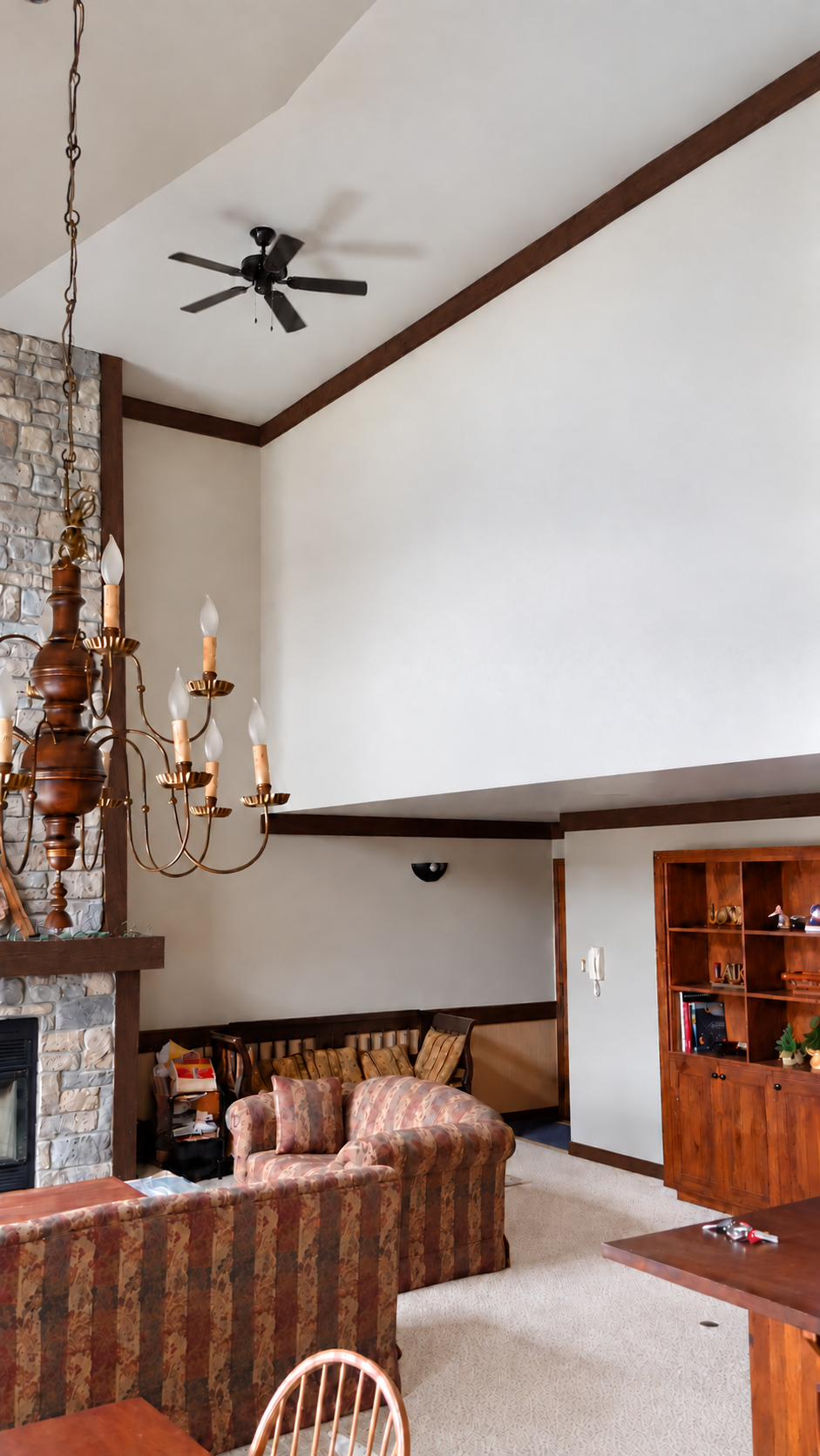 Painted walls and vaulted ceiling over a stone fireplace in Saint-Sauveur