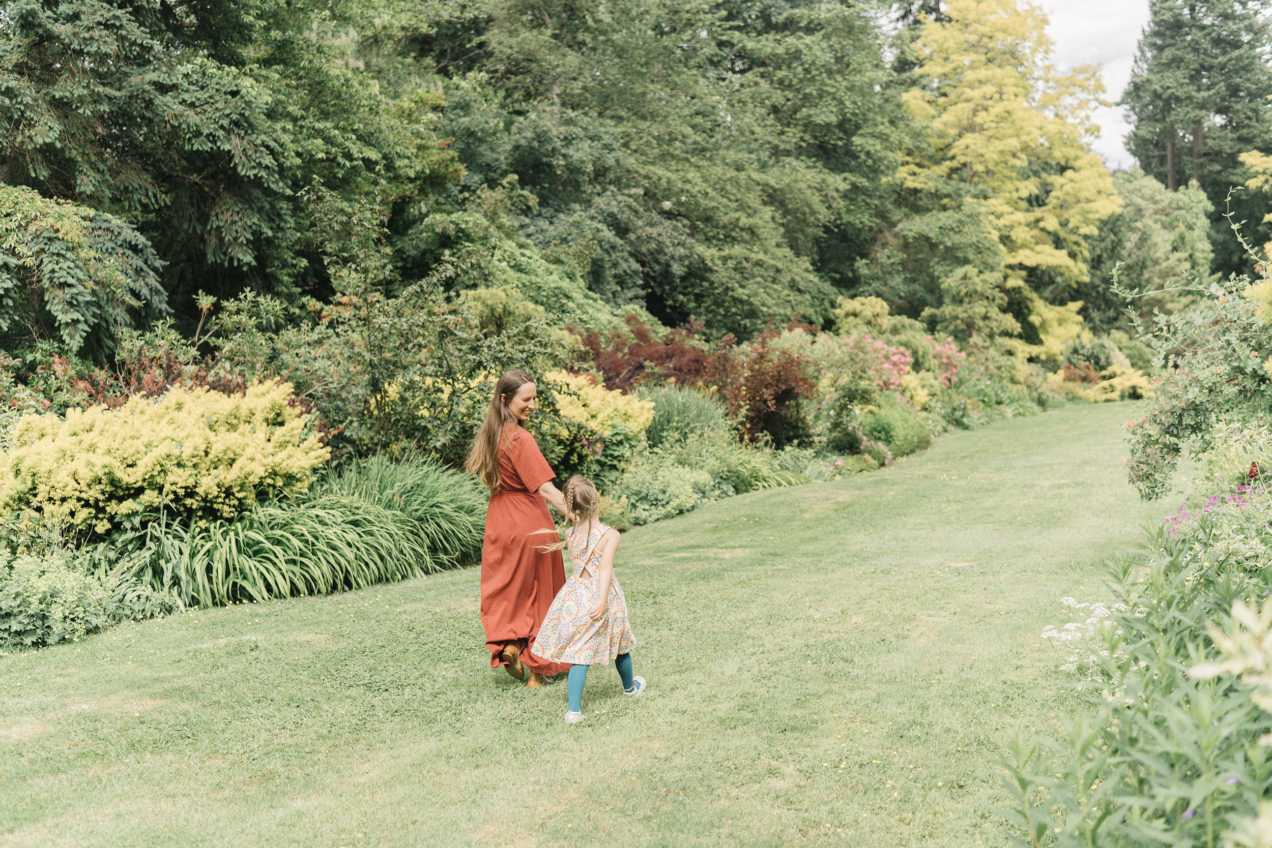 Hannah Glazko, founder of Inn Peace, smiling in a lush green garden setting