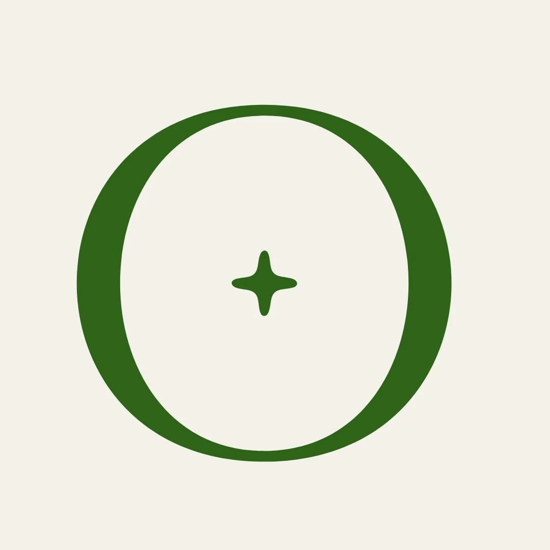 Green circle with a small green star in the center on a light gray background.