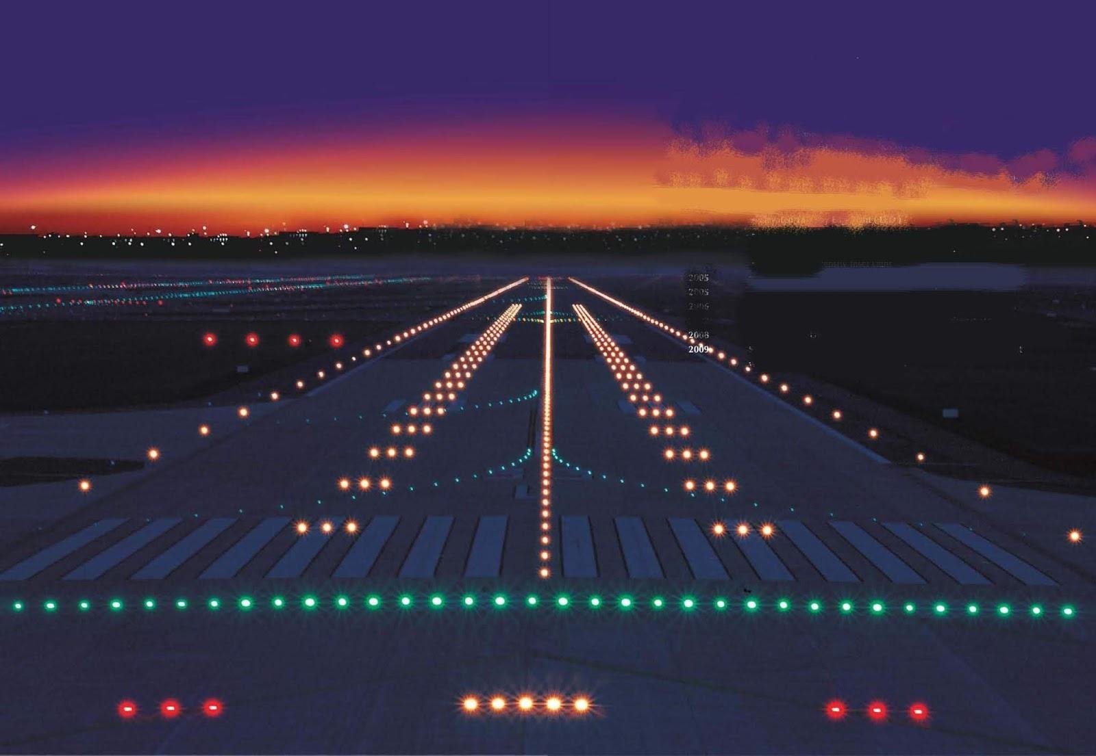 Airport runway and terminal at night