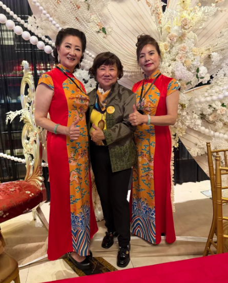 Zonta Club of Greater Queens member, Kitty Lin shum, with two dancers