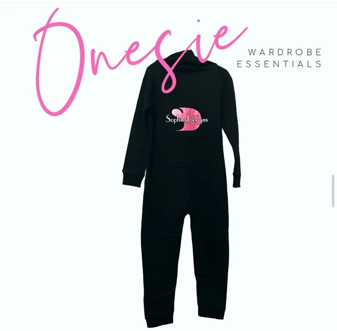 Black sweatshirt and sweatpants with pink and white logo on the front, set against a white background with pink and black text reading "Dreams Wardrobe Essentials."