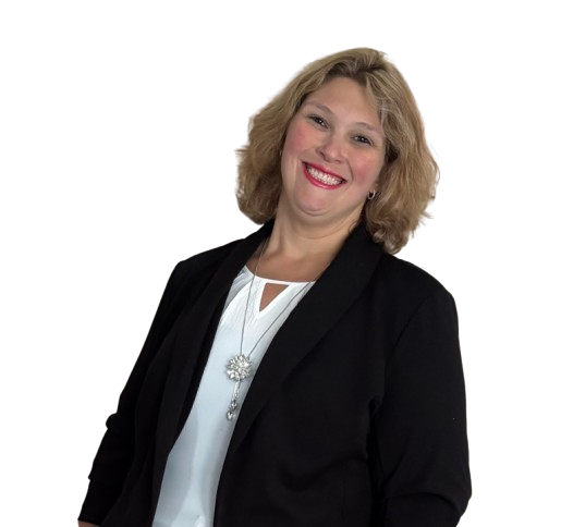 A smiling woman with shoulder-length blonde hair wearing a black blazer over a white blouse, standing against a plain background.