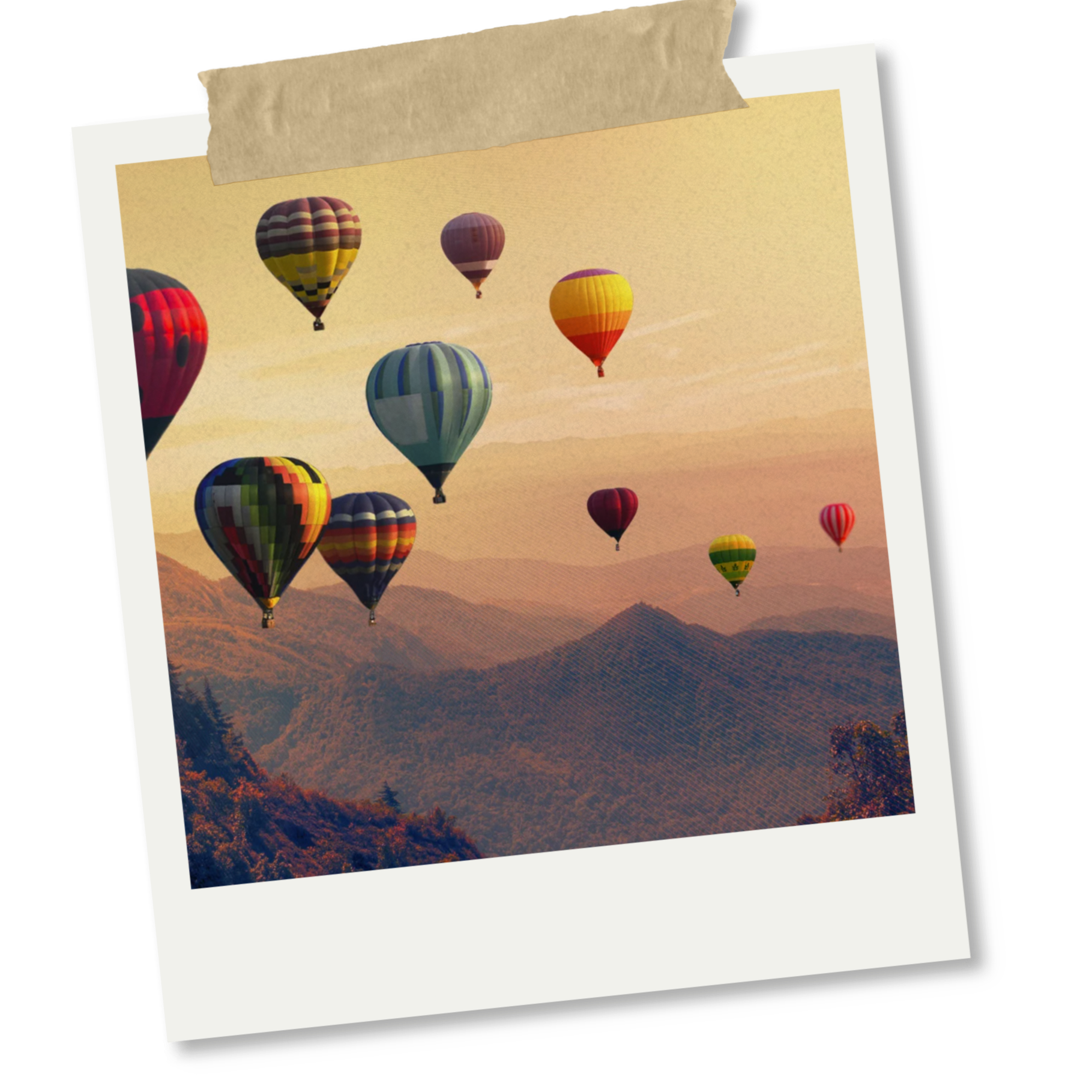 Multiple colorful hot air balloons flying over a mountainous landscape at sunset.