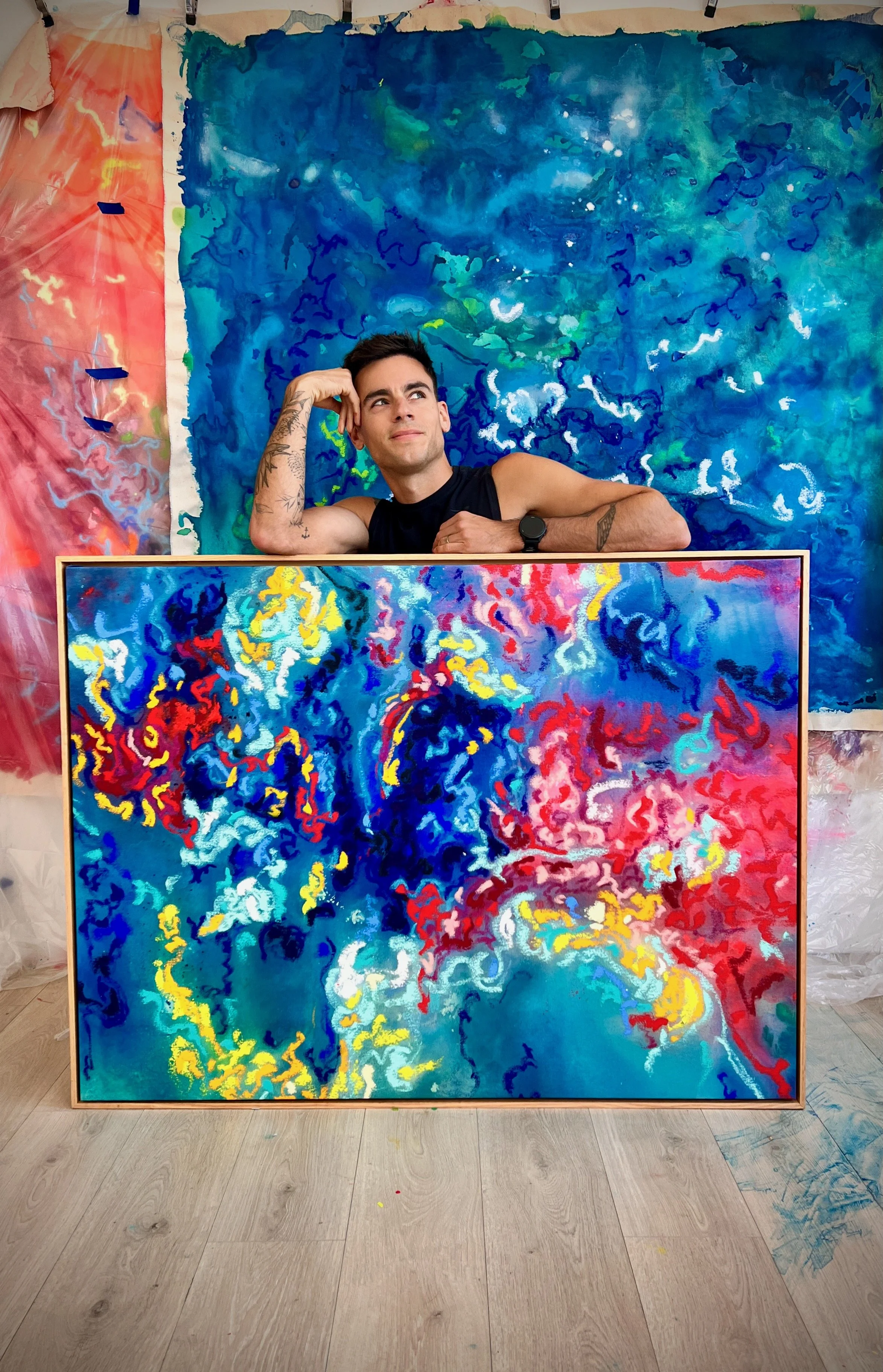 Ian McNamara Artist in front of painting