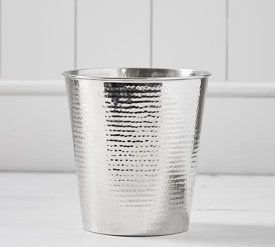 This Hammered-Nickel Wastebasket can be found online or in stores at Pottery Barn.