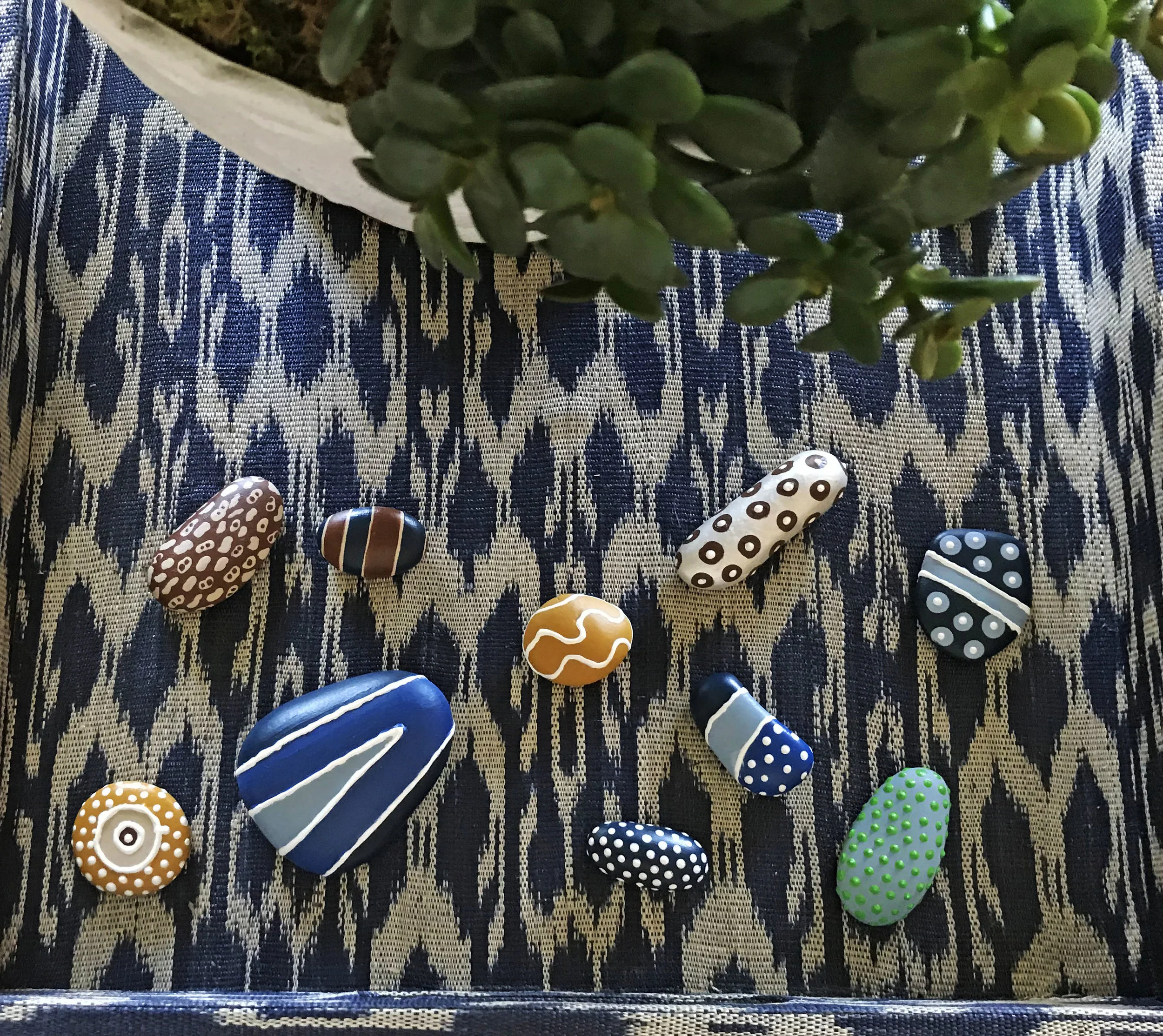 I love this small collection of hand painted rocks. The pattern play makes them an instant curiosity in this tray. Collections are for examining and provoking thought.