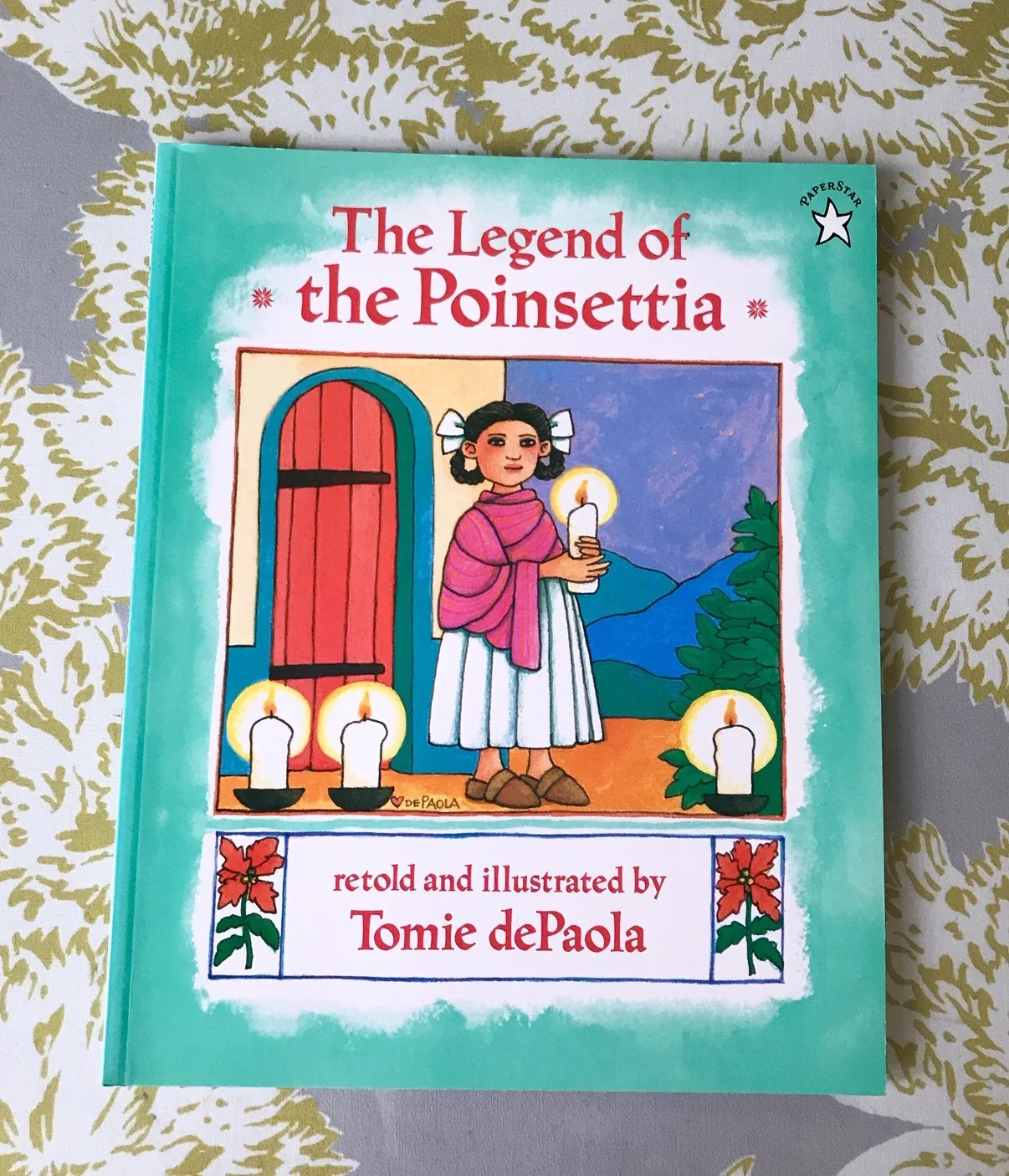 SCW Interiors Life Hacks Blog Post : Poinsettias. Here is one of my favorite Christmas books, “The Legend of the Poinsettia” by Tomie de Paola