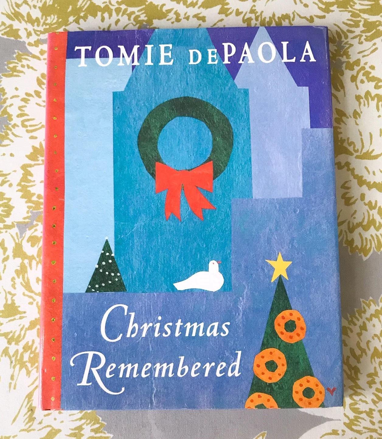 SCW Interiors Life Hacks Blog Post : Poinsettias. Here is another one of my favorite Christmas books by Tomie de Paola, “Christmas Remembered”.