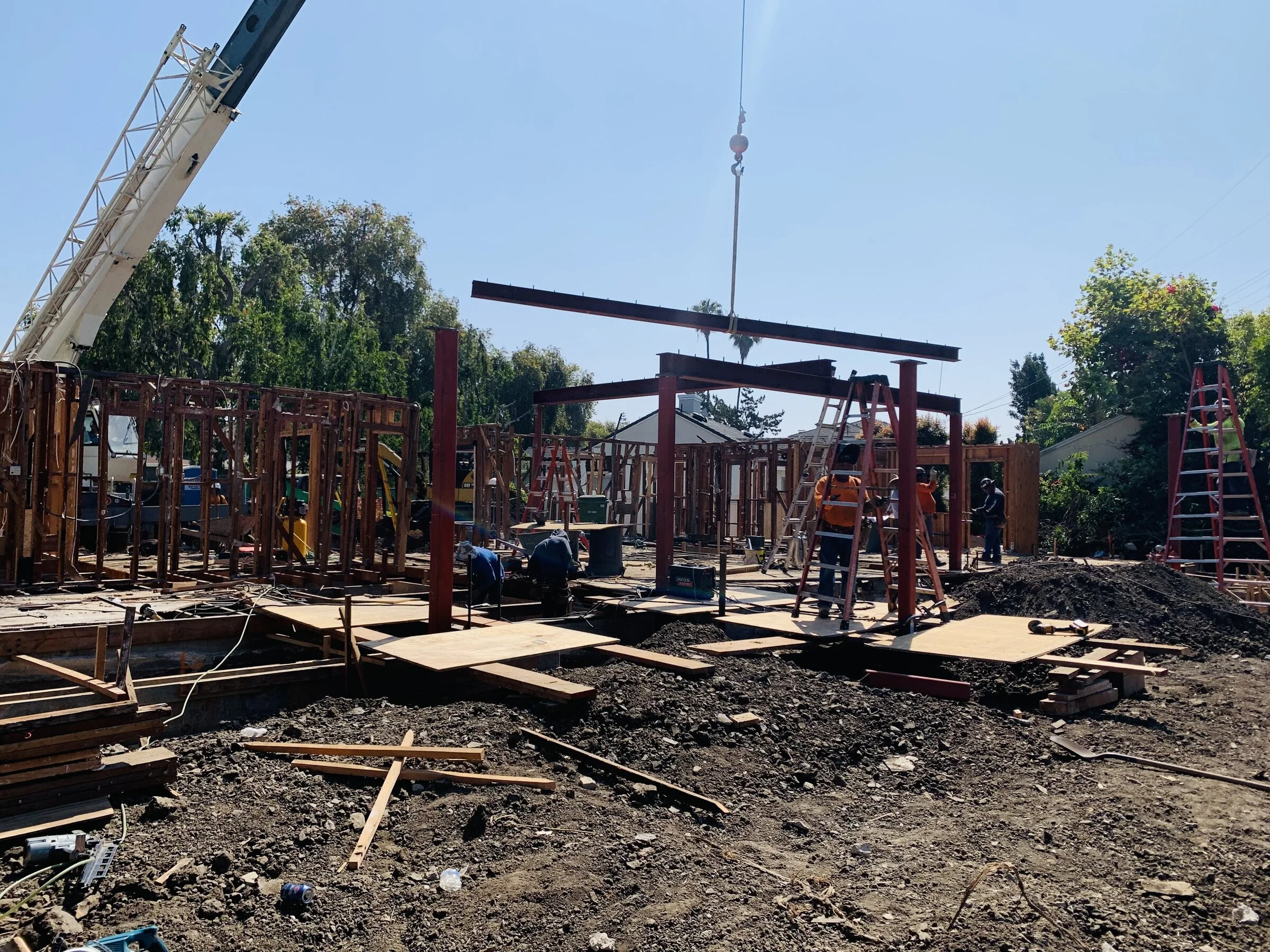 [new-construction] Crane setting a steel moment frame on a ground-up custom home in Los Angeles