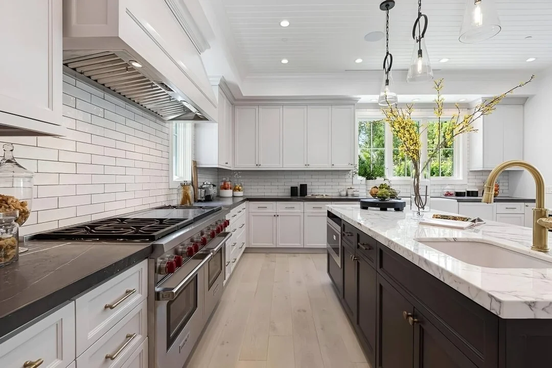 [kitchen-remodeling] Kitchen with professional range, dark marble-top island, gold faucet, and subway tile, Cheviot Hills custom home