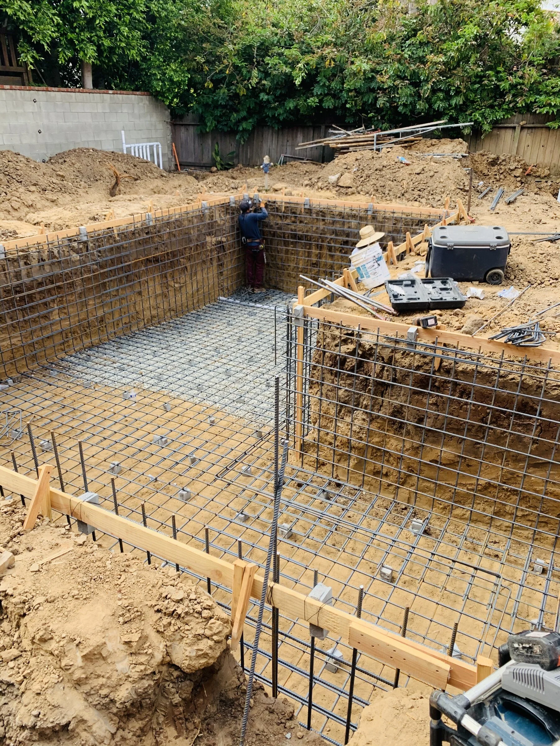 [new-construction] Fully tied rebar cage in a reinforced concrete pit on a Los Angeles construction site