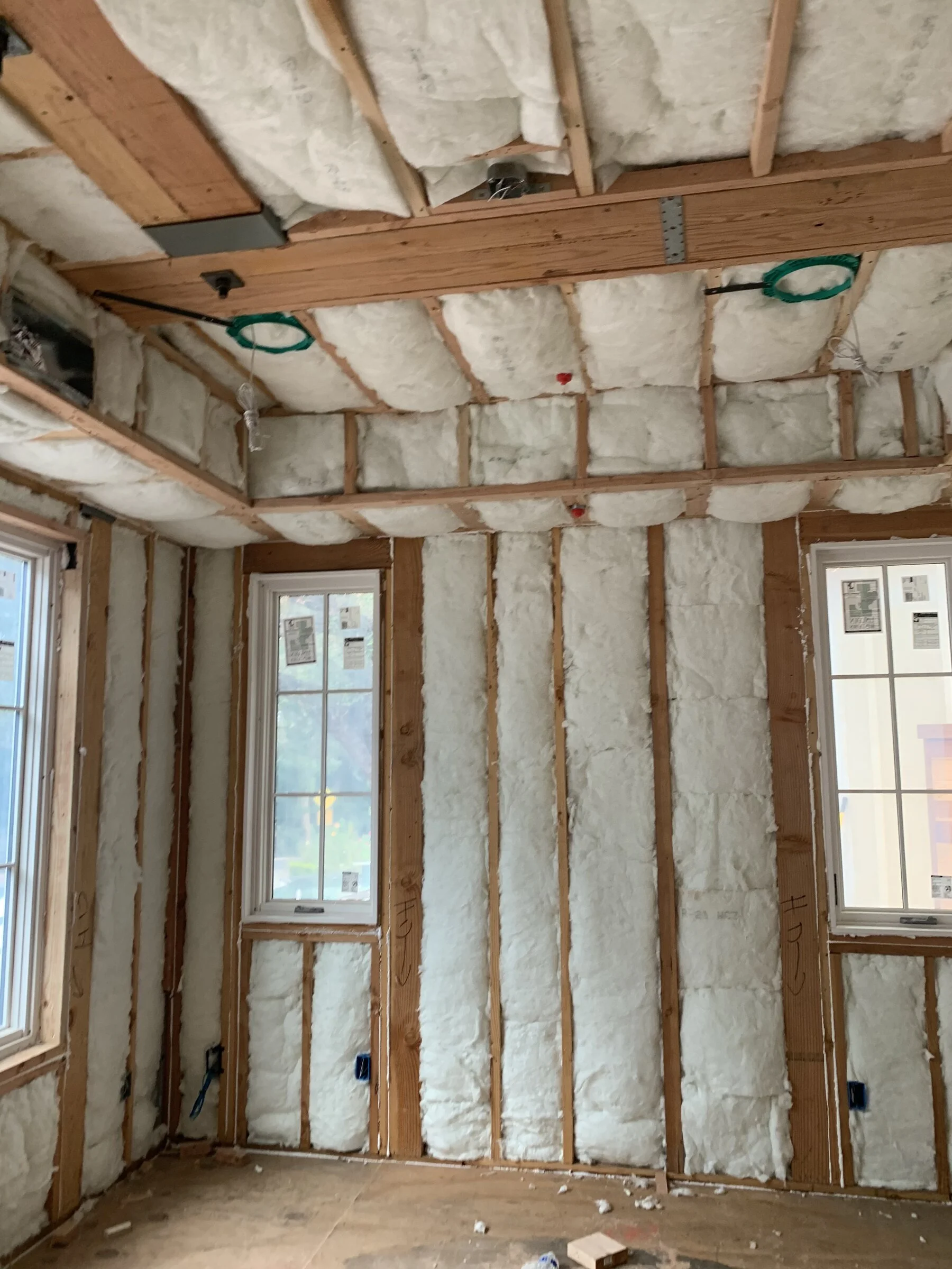 [new-construction] Insulated interior walls and ceiling with framed windows and electrical rough-in in a Los Angeles home